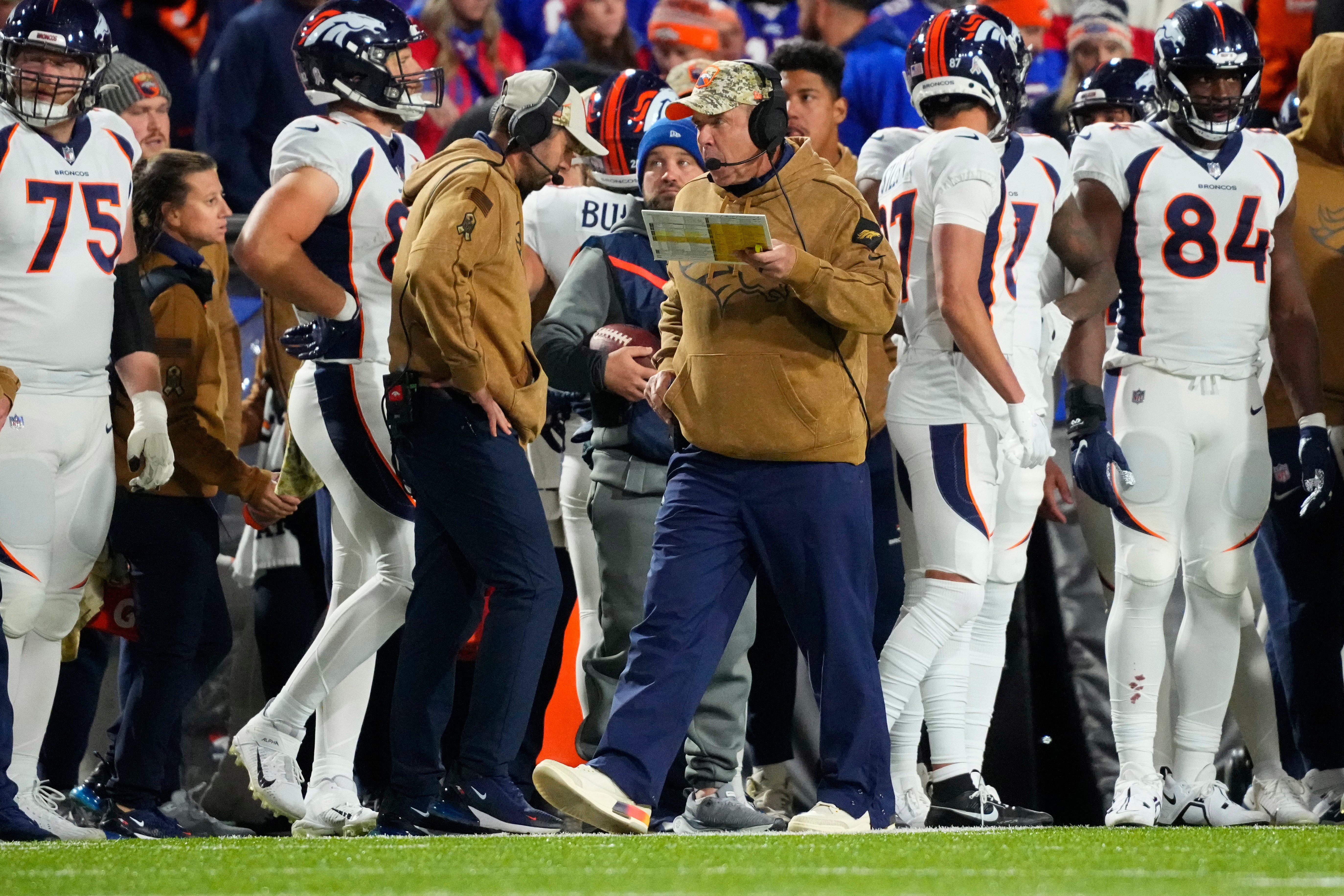 Denver Broncos head coach Sean Payton calls a play from the sideline during the second half against the Buffalo Bills at Highmark Stadium.