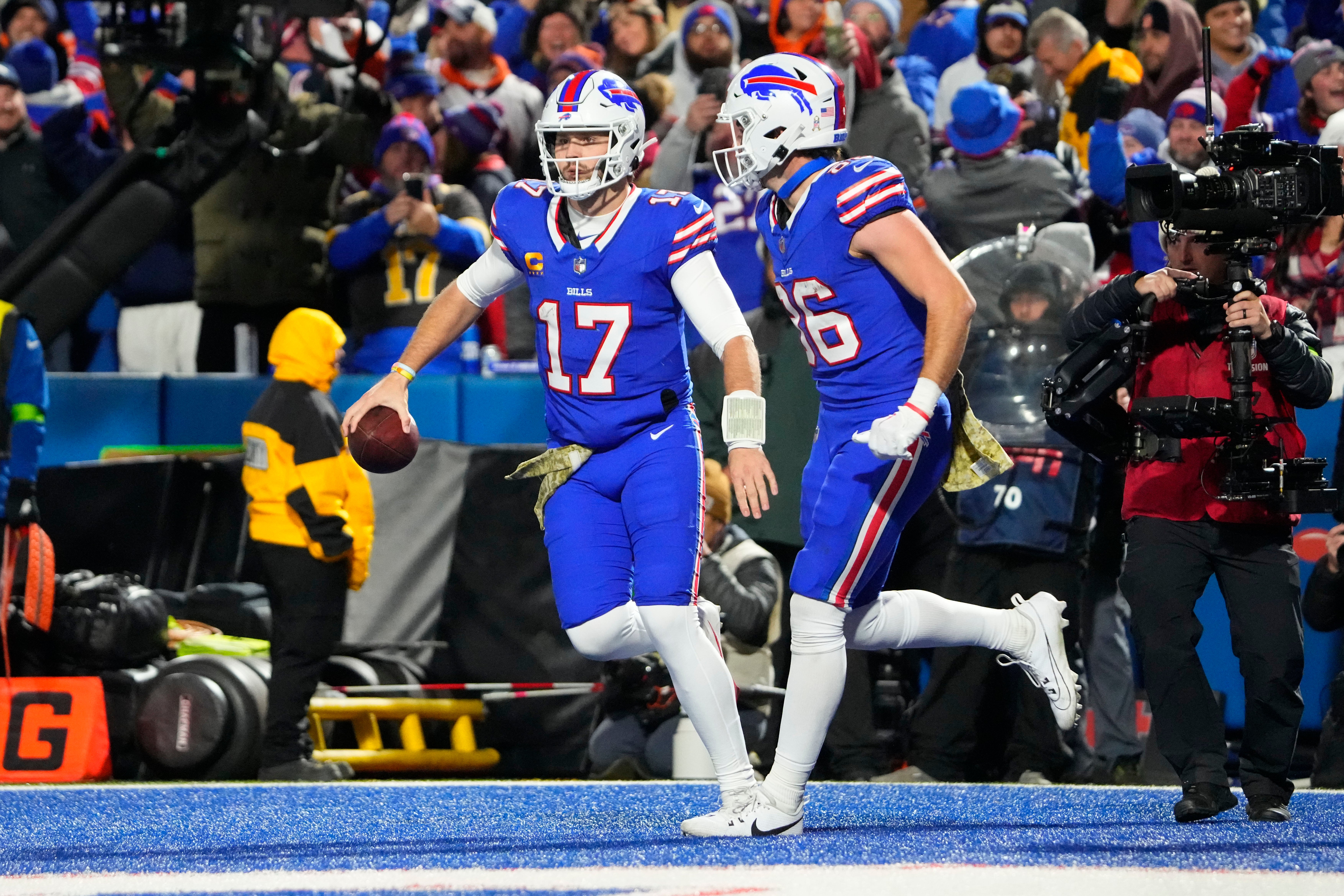 Buffalo Bills tight end Dalton Kincaid (86) congratulates quarterback Josh Allen (17) for scoring a touchdown against the Denver Broncos during the second half at Highmark Stadium.