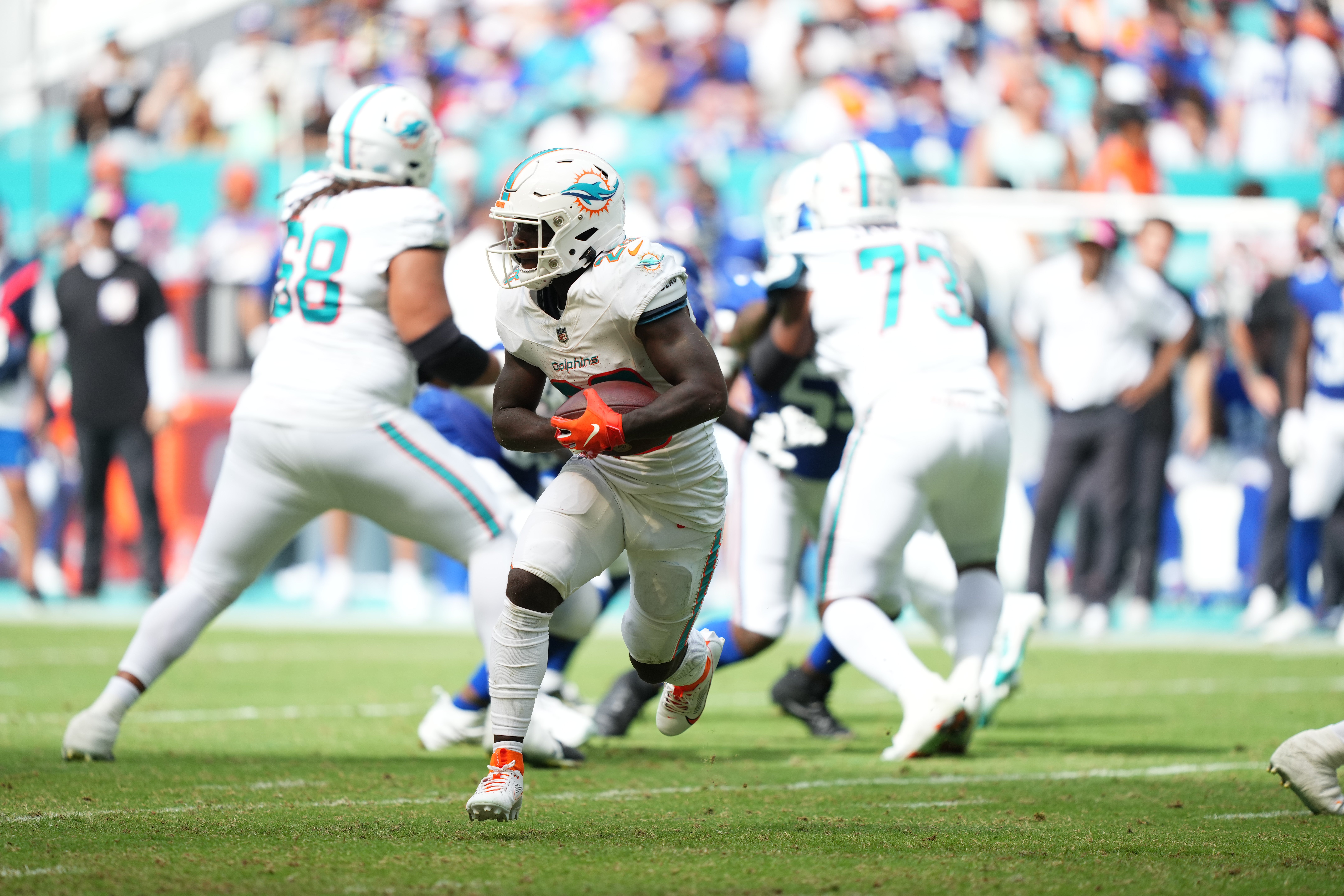 Oct 8, 2023; Miami Gardens, Florida, USA; Miami Dolphins running back De'Von Achane (28) runs the ball against the New York Giants during the second half at Hard Rock Stadium. Mandatory Credit: Jasen Vinlove-USA TODAY Sports