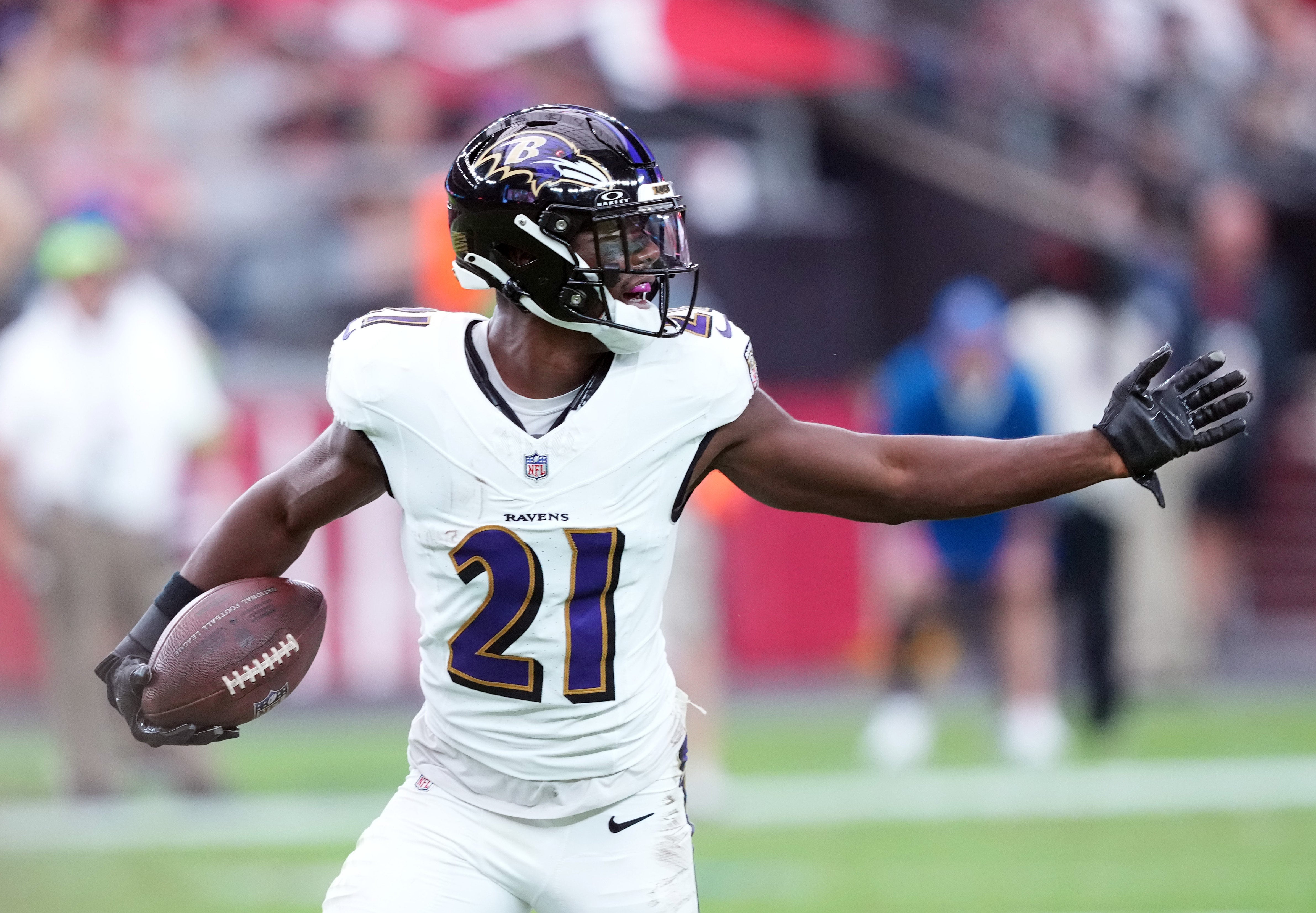 Baltimore Ravens cornerback Brandon Stephens (21) celebrates an interception against the Arizona Cardinals during the first half at State Farm Stadium.