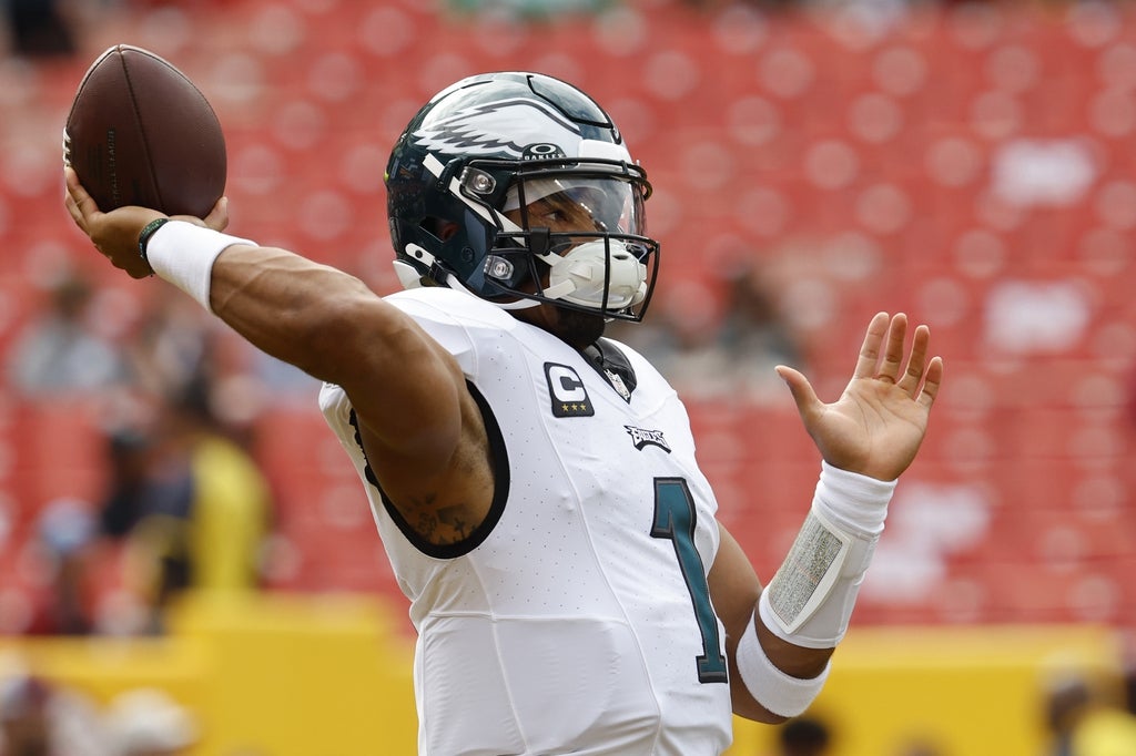 Philadelphia Eagles quarterback Jalen Hurts passes the ball during warmup prior to the game Washington Commanders at FedExField.