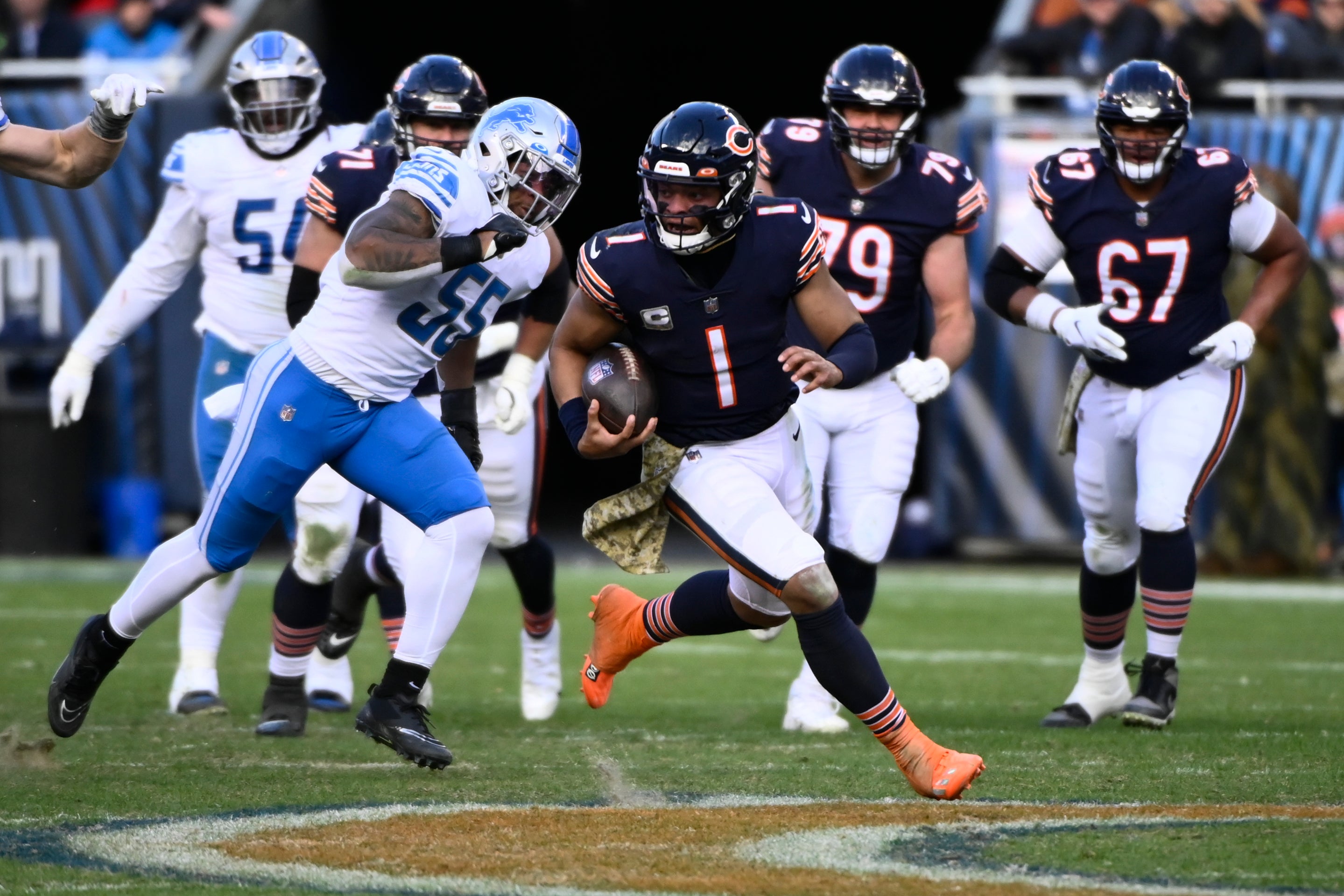 Nov 13, 2022; Chicago, Illinois, USA; Chicago Bears quarterback Justin Fields (1) runs for a touchdown against the Detroit Lions during the second half at Soldier Field.