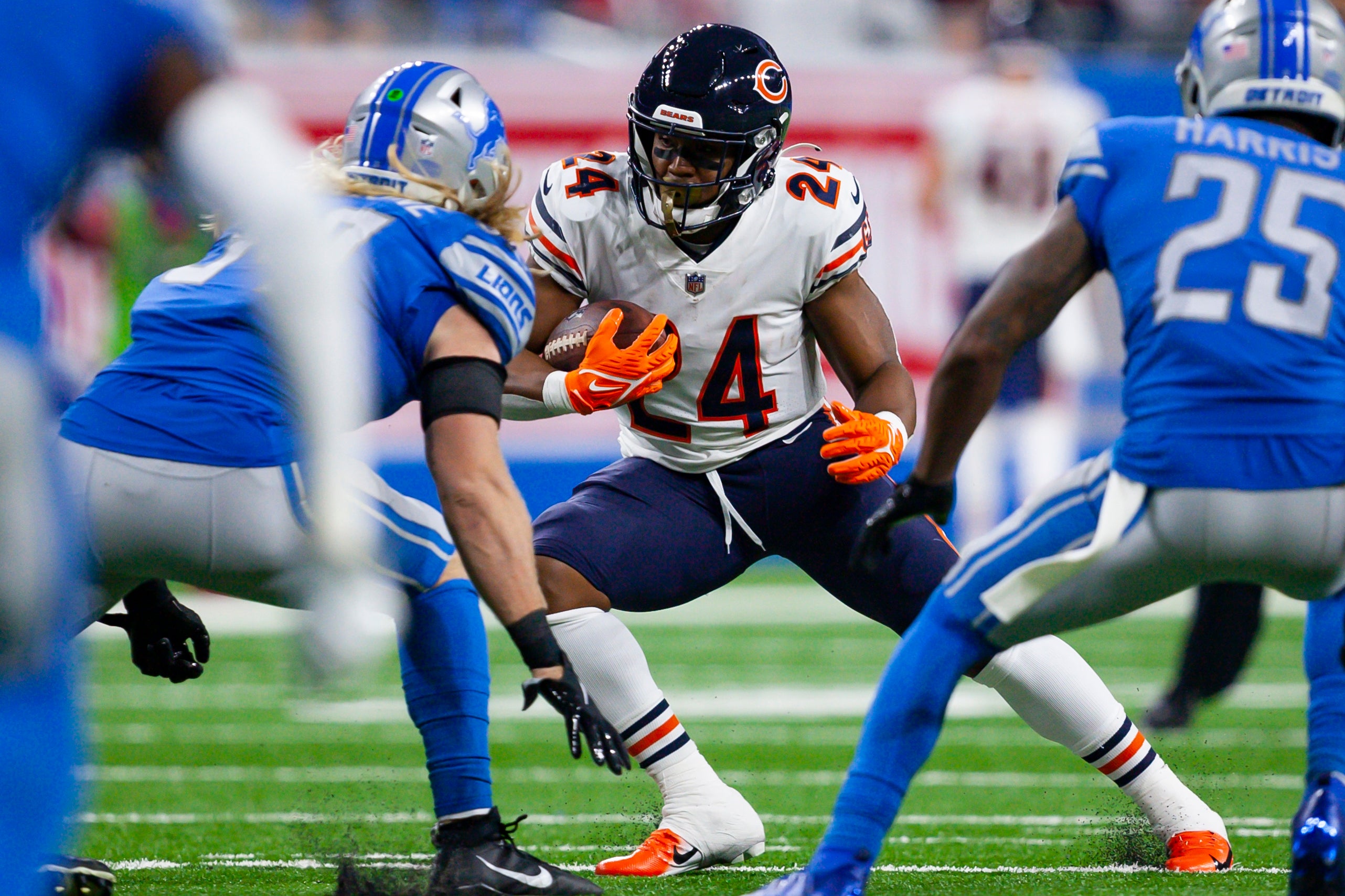 Nov 25, 2021; Detroit, Michigan, USA; Chicago Bears running back Khalil Herbert (24) runs the ball against Detroit Lions inside linebacker Alex Anzalone (34) during the third quarter at Ford Field.