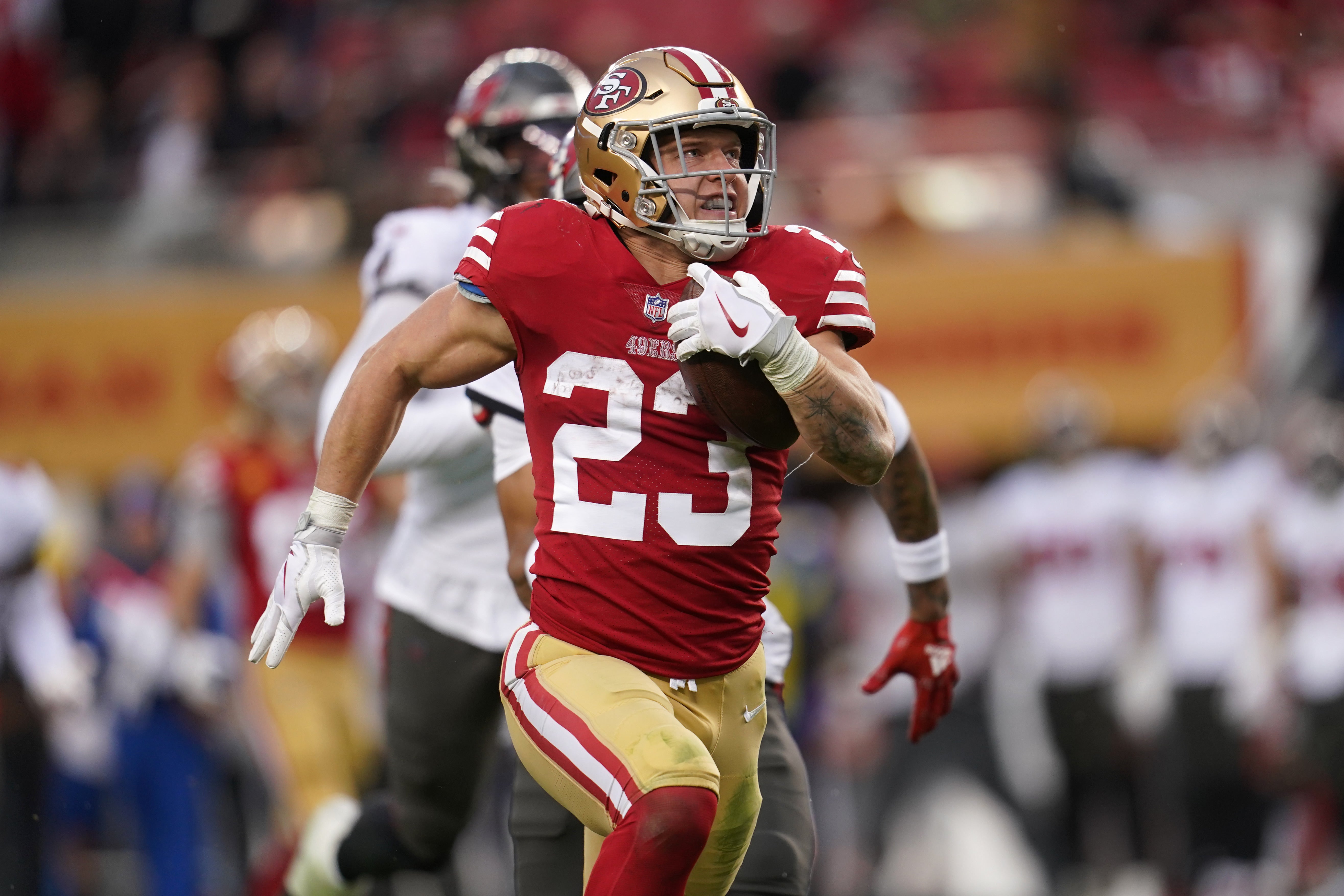 Dec 11, 2022; Santa Clara, California, USA; San Francisco 49ers running back Christian McCaffrey (23) runs for a 38 yard touchdown against the Tampa Bay Buccaneers in the third quarter at Levi's Stadium.