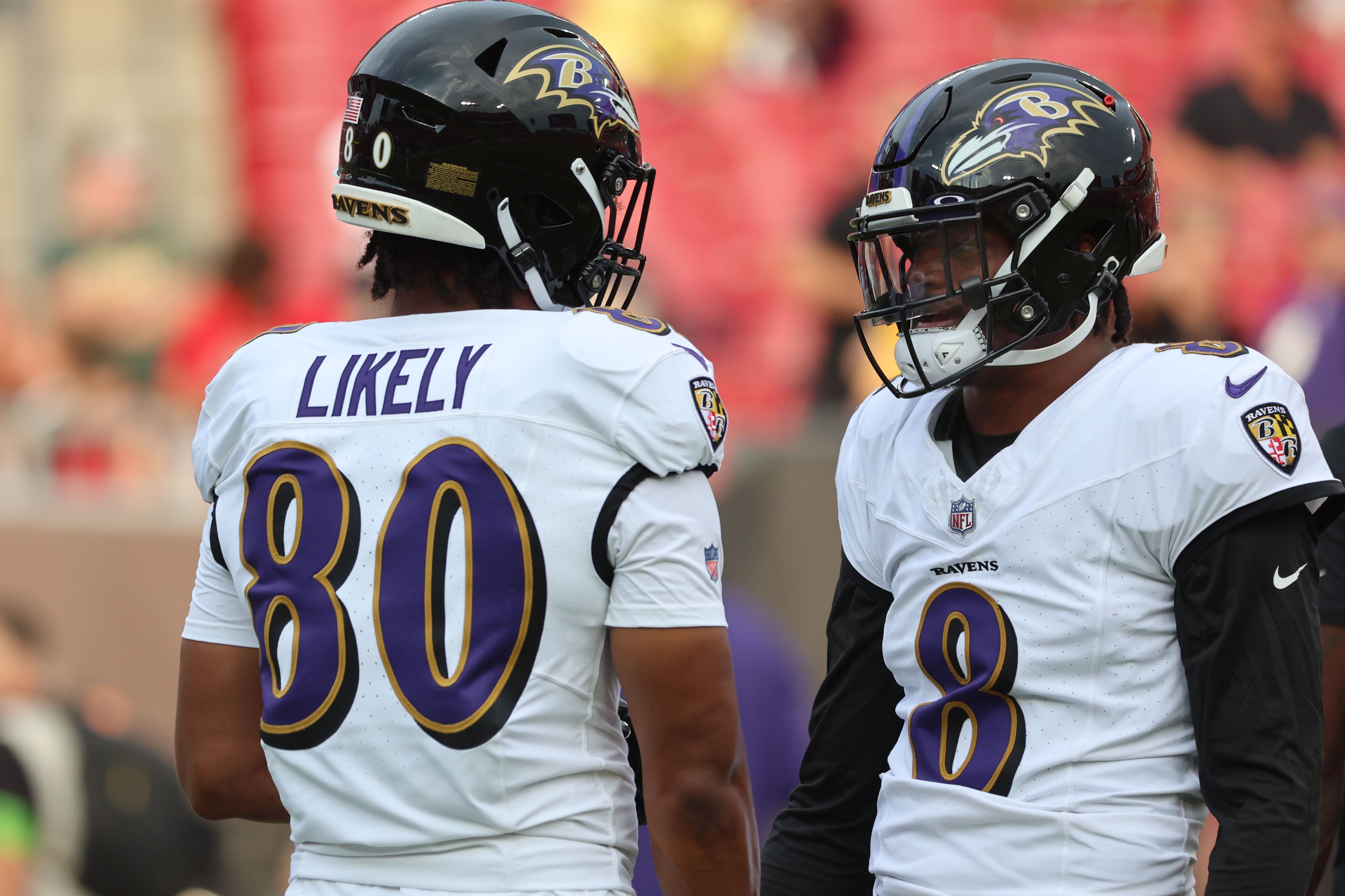 Baltimore Ravens quarterback Lamar Jackson (8) and tight end Isaiah Likely (80) talk as they work out against the Tampa Bay Buccaneers prior to the game at Raymond James Stadium. Mandatory Credit: Kim Klement Neitzel-USA TODAY Sports