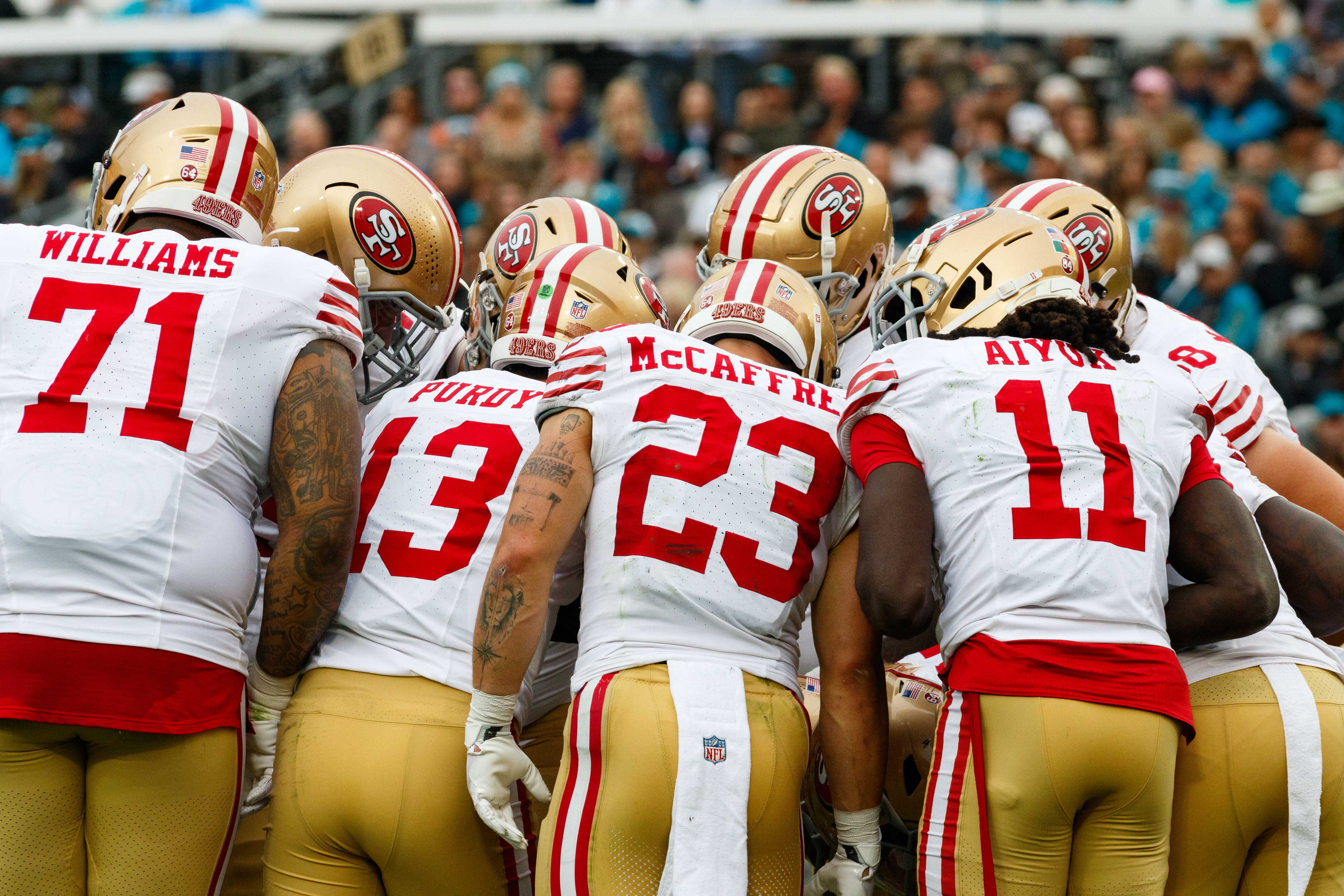 Nov 12, 2023; Jacksonville, Florida, USA; San Francisco 49ers offense huddles around quarterback Brock Purdy (13) against Jacksonville Jaguars during the second quarter at EverBank Stadium.