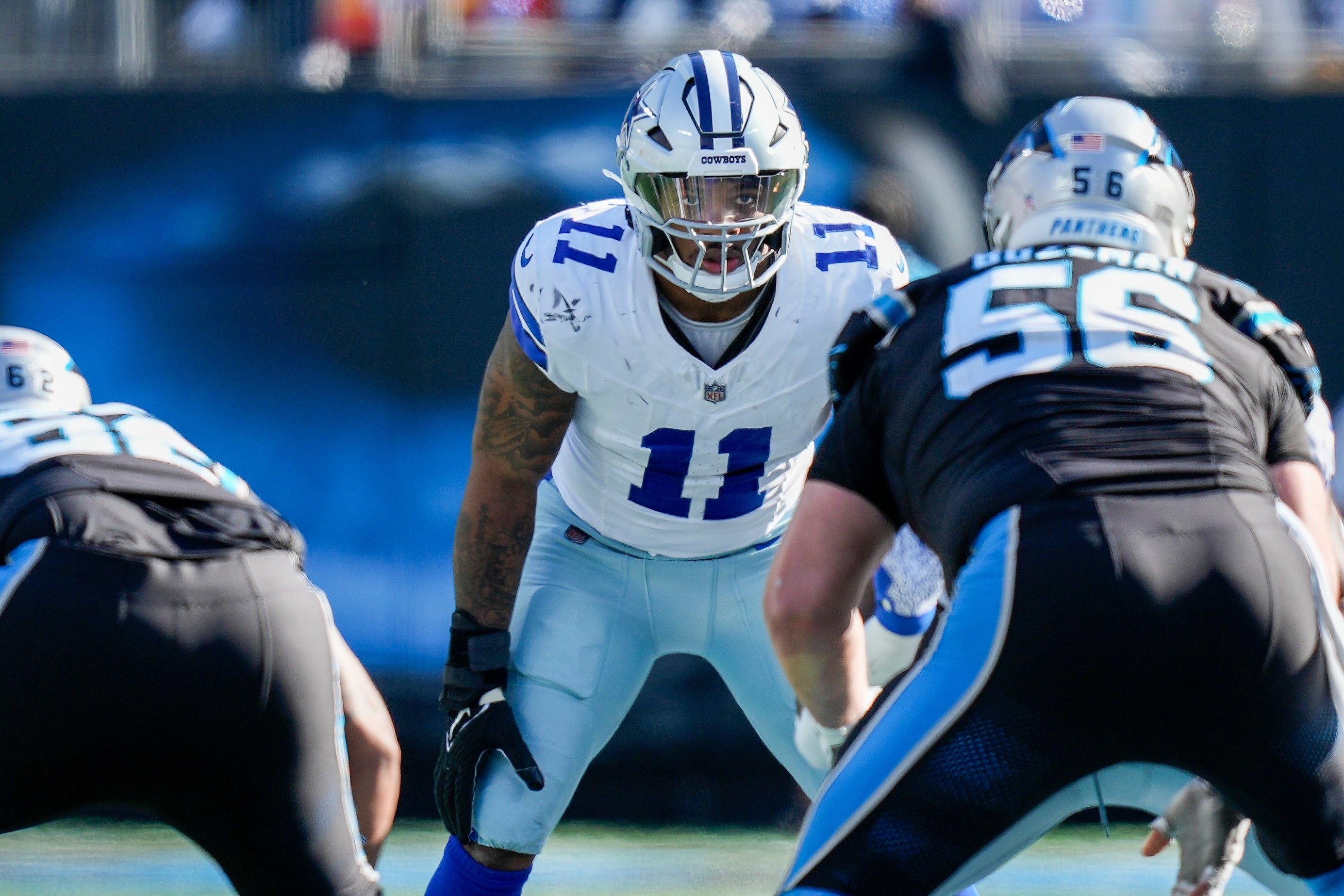 Dallas Cowboys linebacker Micah Parsons (11) eyes the offense during the second quarter against the Carolina Panthers at Bank of America Stadium.