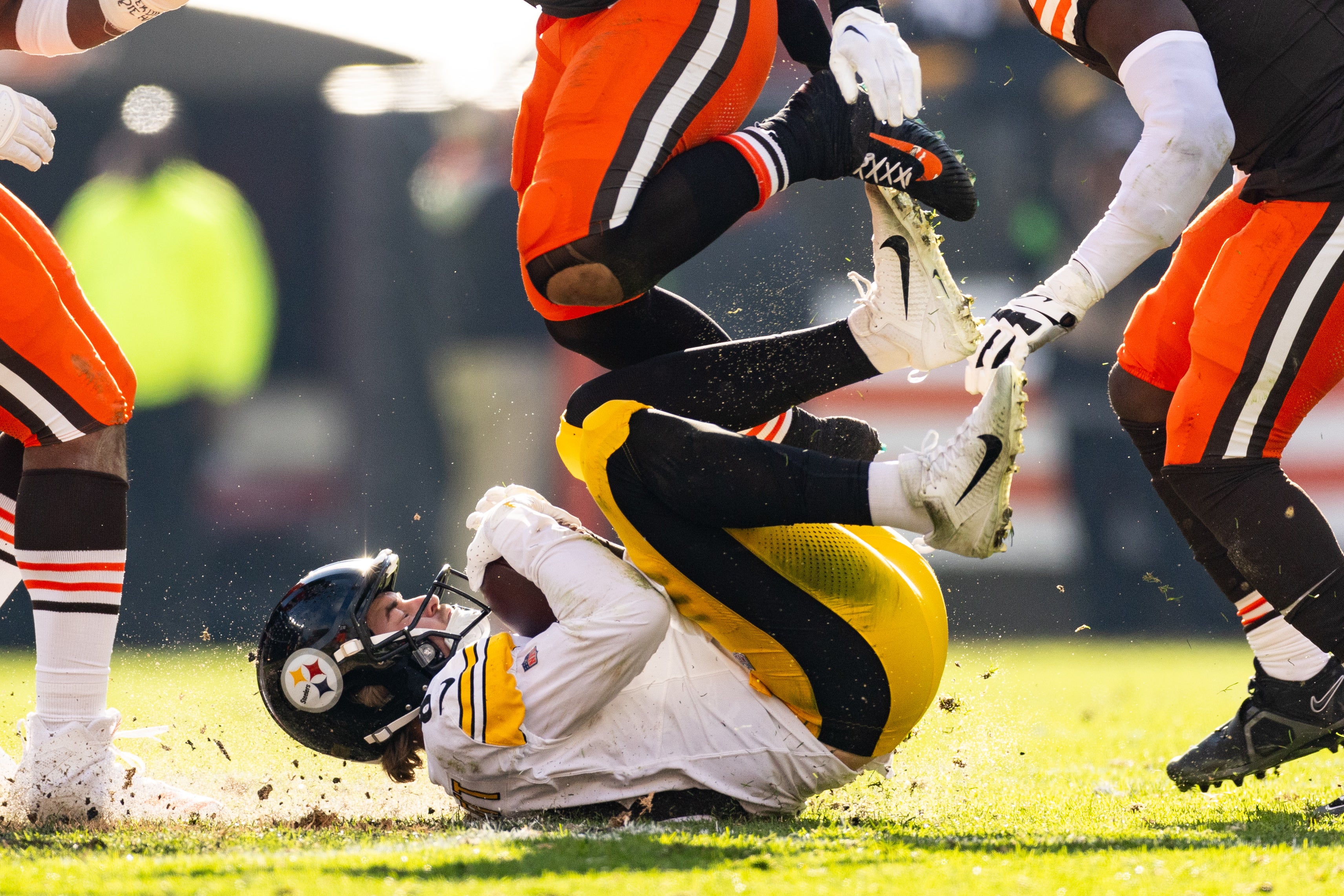 Nov 19, 2023; Cleveland, Ohio, USA; Pittsburgh Steelers quarterback Kenny Pickett (8) rolls on the ground after sliding to avoid a tackle by the Cleveland Browns during the second quarter at Cleveland Browns Stadium. Mandatory Credit: Scott Galvin-USA TODAY Sports  