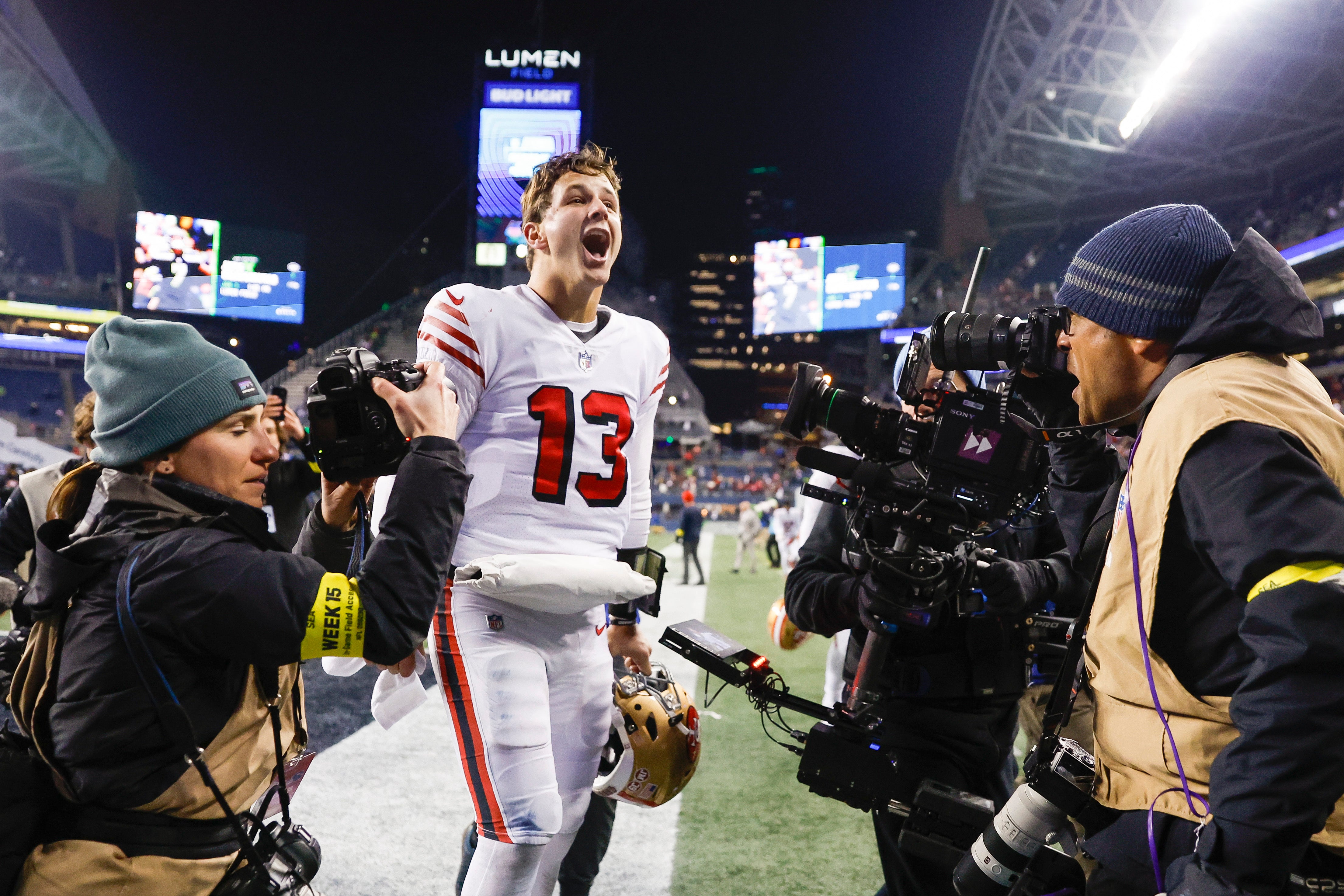 Dec 15, 2022; Seattle, Washington, USA; San Francisco 49ers quarterback Brock Purdy (13) celebrates on his way to the locker room following a 21-13 victory against the Seattle Seahawks at Lumen Field.