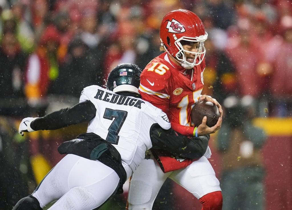 Kansas City Chiefs quarterback Patrick Mahomes is sacked by Philadelphia Eagles linebacker Haason Reddick during the first half at GEHA Field at Arrowhead Stadium.