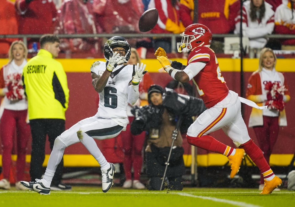 Philadelphia Eagles wide receiver DeVonta Smith (6) catches a pass against Kansas City Chiefs safety Mike Edwards (21) during the second half at GEHA Field at Arrowhead Stadium.