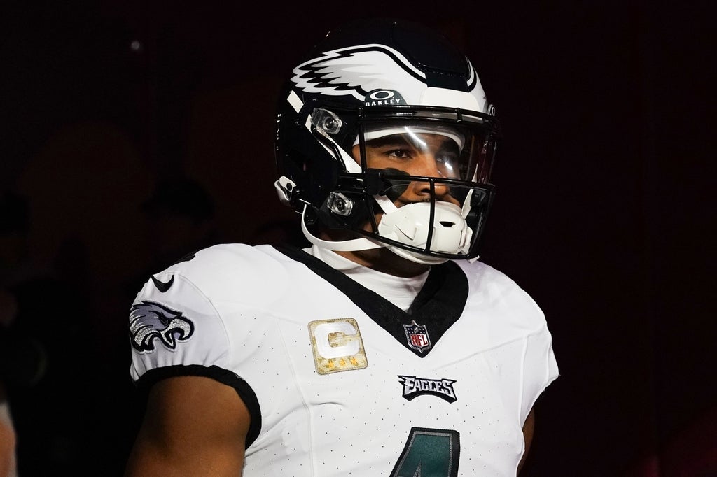Philadelphia Eagles quarterback Jalen Hurts walks out on the field against the Kansas City Chiefs prior to a game at GEHA Field at Arrowhead Stadium.