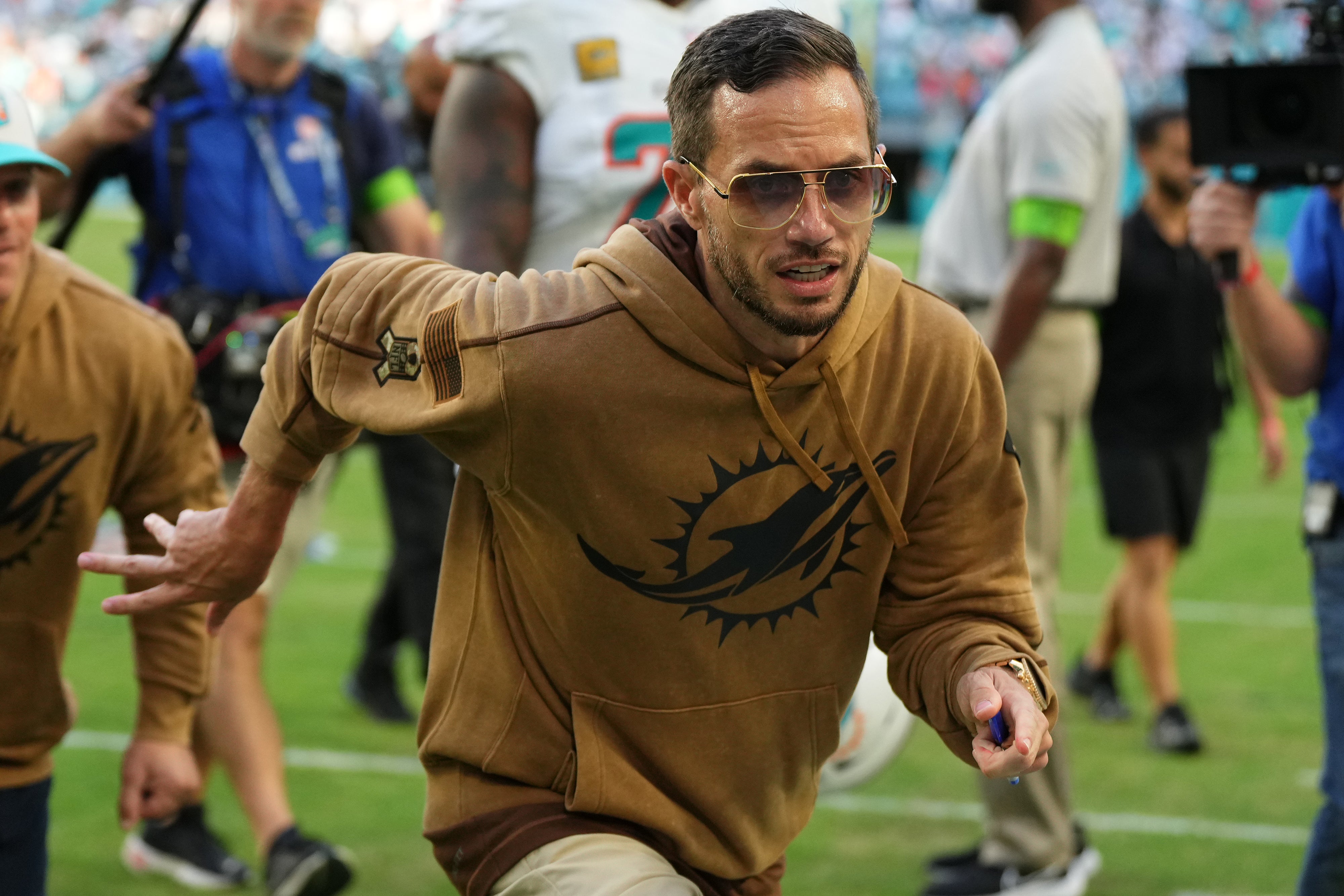 Nov 19, 2023; Miami Gardens, Florida, USA; Miami Dolphins head coach Mike McDaniel runs off the field after defeating the Las Vegas Raiders at Hard Rock Stadium. Mandatory Credit: Jasen Vinlove-USA TODAY Sports