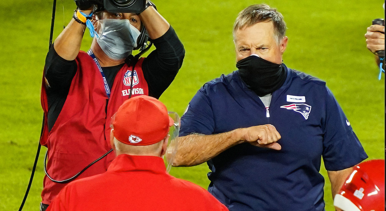 New England Patriots head coach Bill Belichick greets Kansas City Chiefs head coach Andy Reid after the game at Arrowhead Stadium.