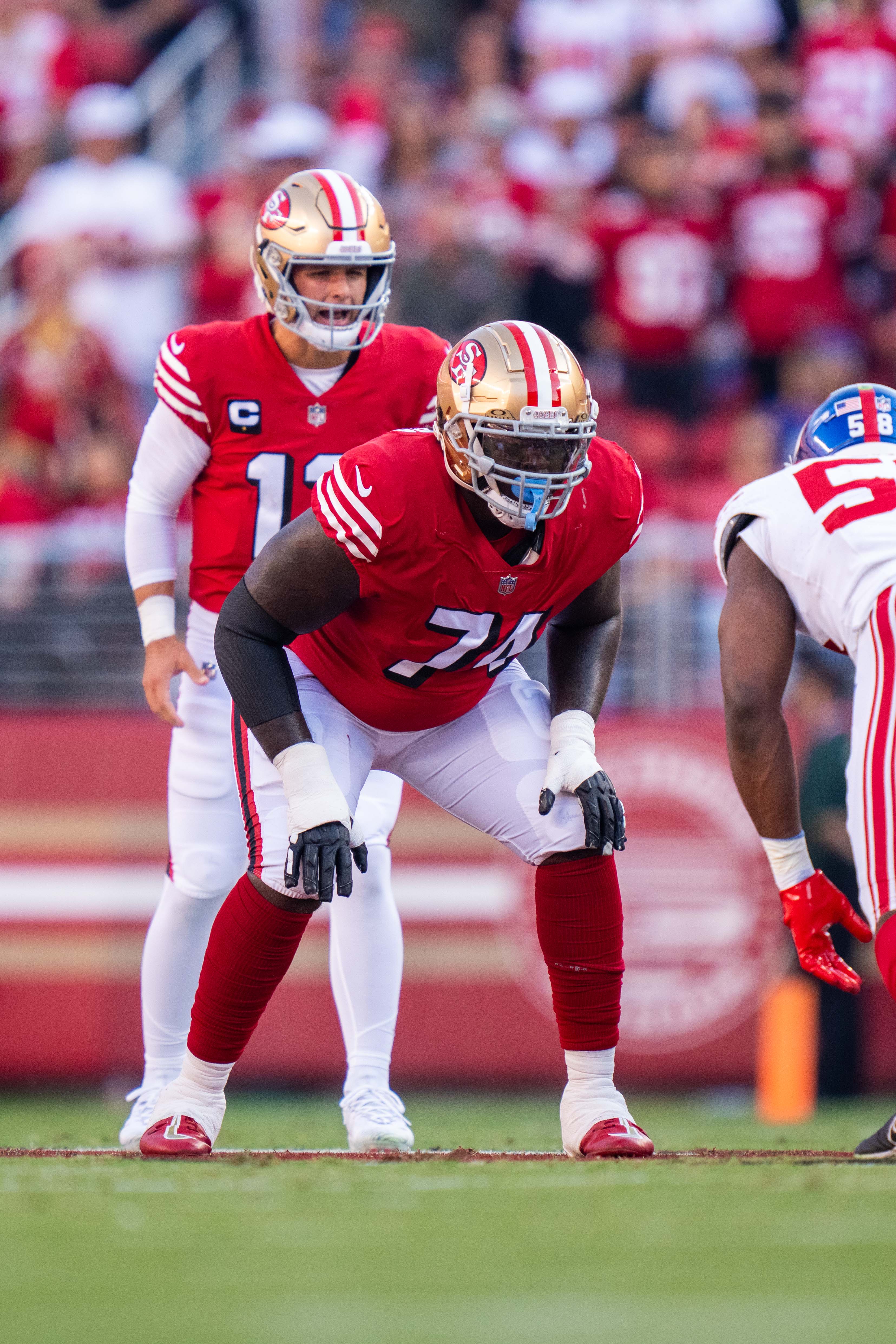September 21, 2023; Santa Clara, California, USA; San Francisco 49ers offensive tackle Spencer Burford (74) stands in front of quarterback Brock Purdy (13) during the first quarter against the New York Giants at Levi's Stadium.