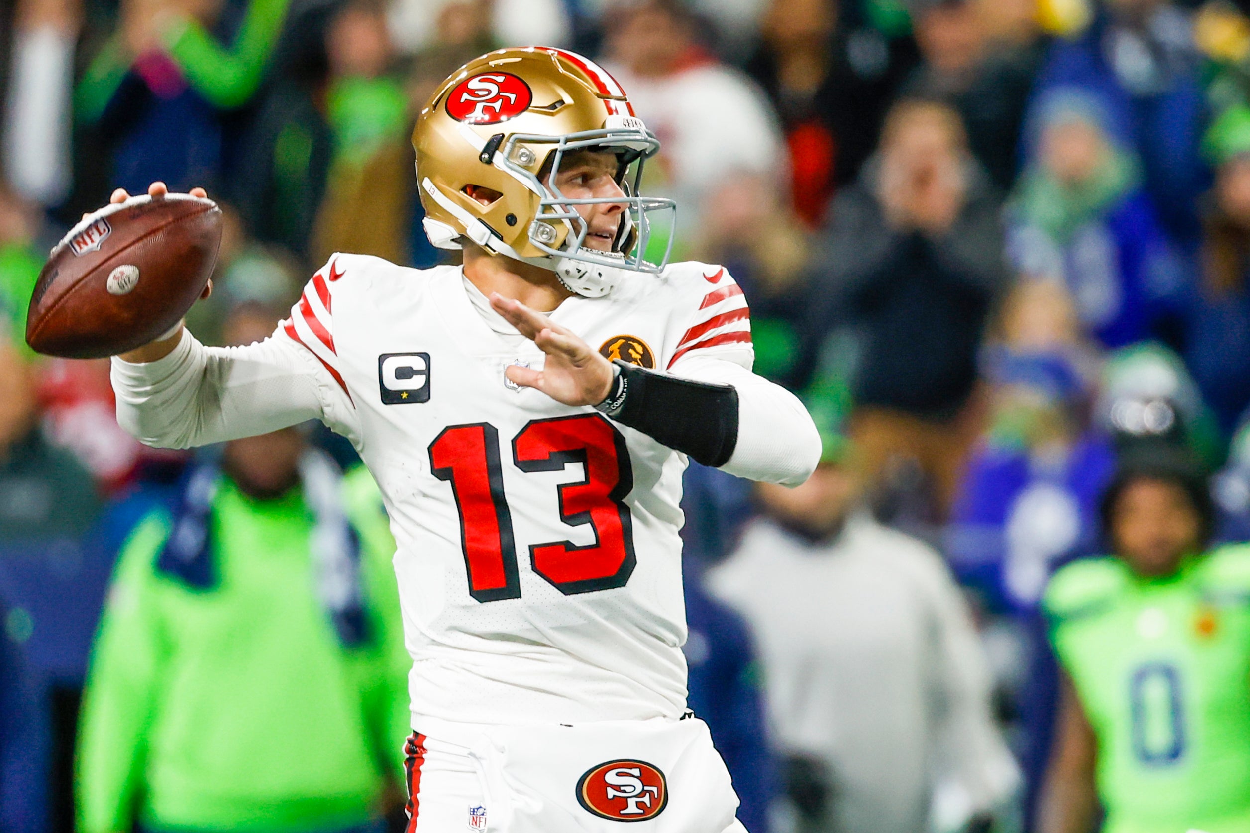 Nov 23, 2023; Seattle, Washington, USA; San Francisco 49ers quarterback Brock Purdy (13) passes against the Seattle Seahawks during the second quarter at Lumen Field.