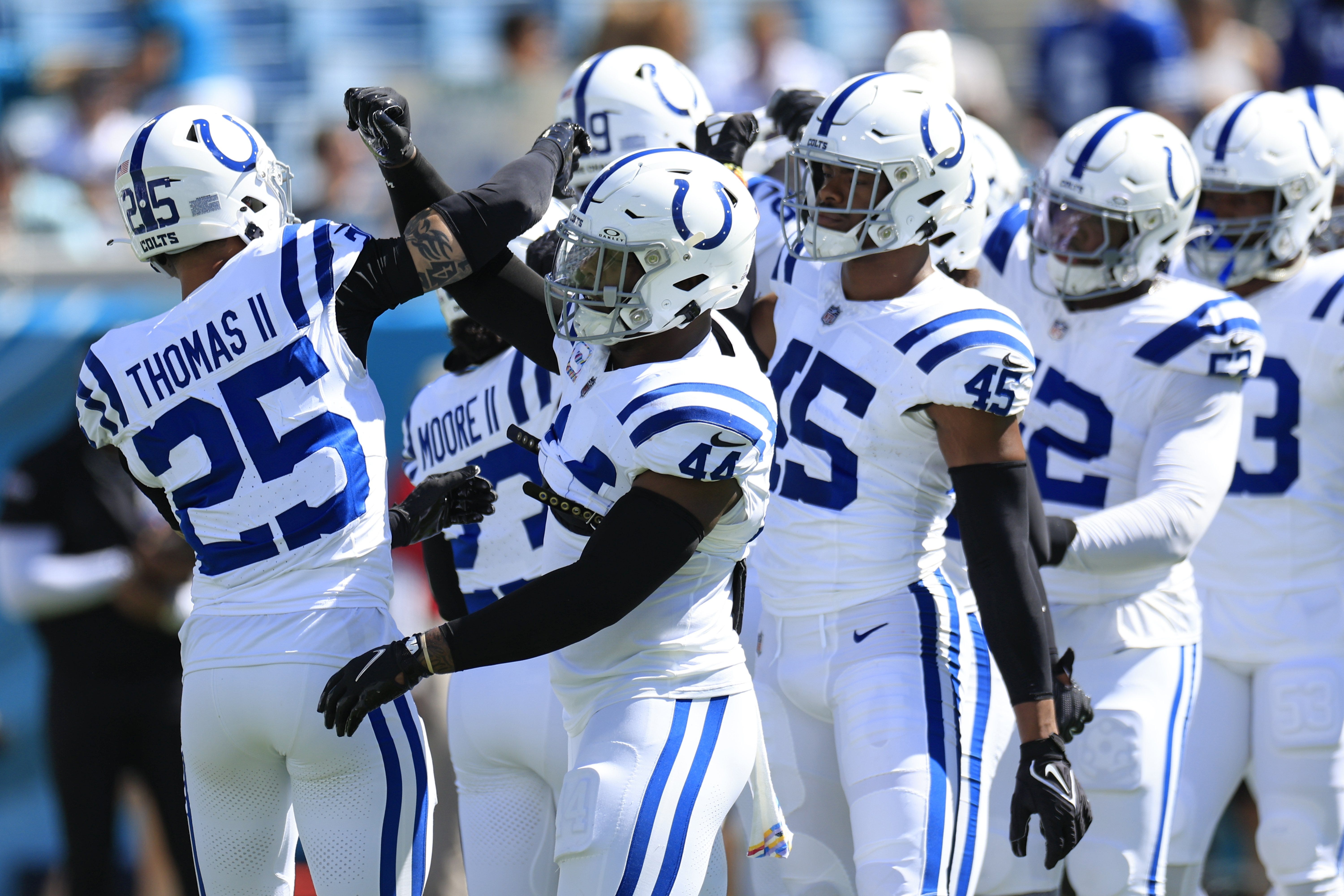 Indianapolis Colts linebacker Zaire Franklin (44) greets safety Rodney Thomas II (25) before an NFL football matchup Sunday, Oct. 15, 2023 at EverBank Stadium in Jacksonville, Fla.
