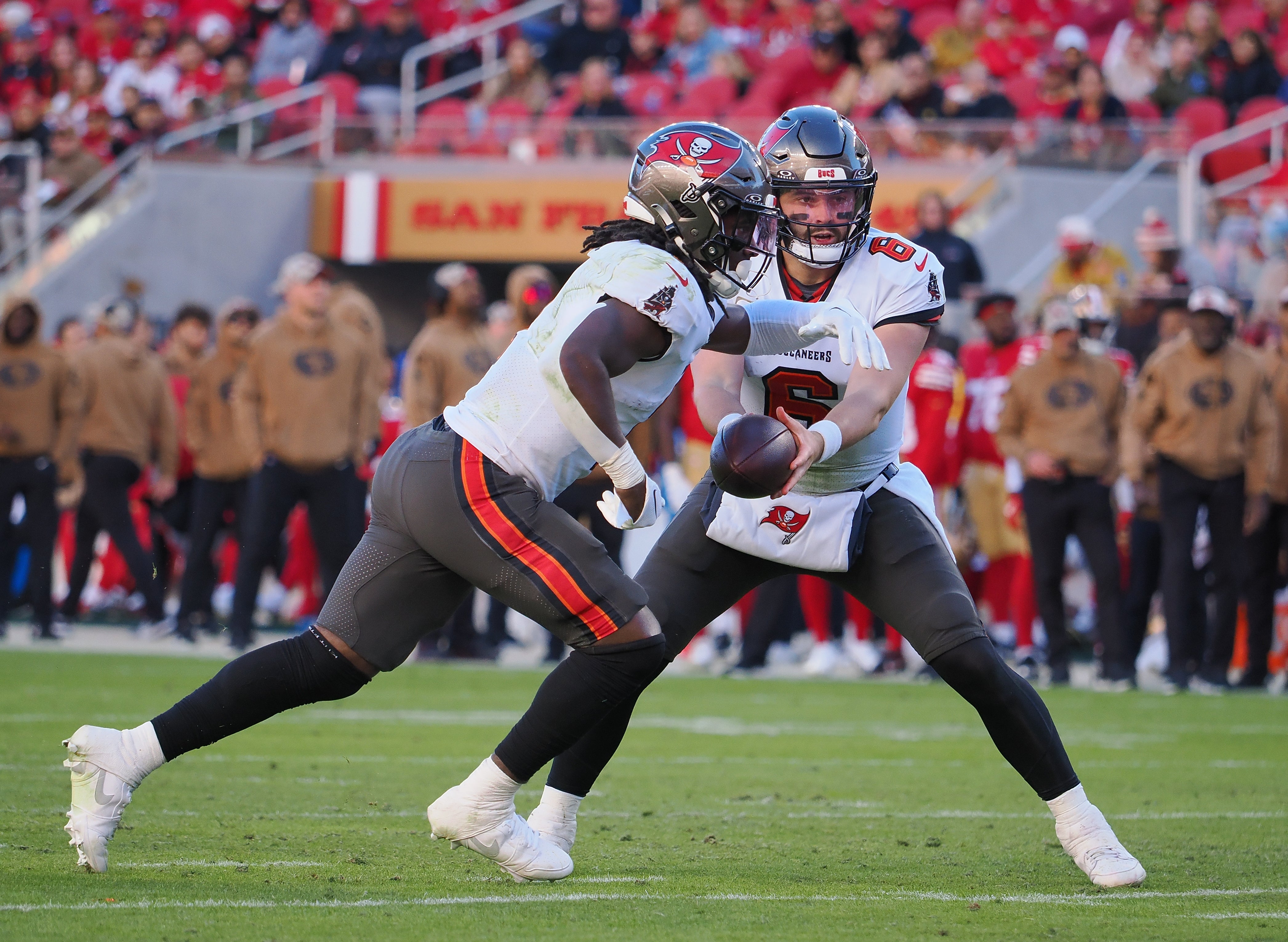 Nov 19, 2023; Santa Clara, California, USA; Tampa Bay Buccaneers quarterback Baker Mayfield (6) hands off the ball to Tampa Bay Buccaneers running back Rachaad White (1) for a touchdown run against the San Francisco 49ers during the fourth quarter at Levi's Stadium. Mandatory Credit: Kelley L Cox-USA TODAY Sports