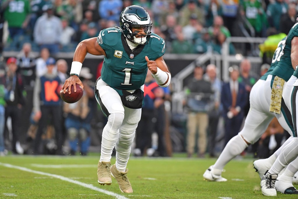 Philadelphia Eagles quarterback Jalen Hurts runs with the ball against the Dallas Cowboys during the first quarter at Lincoln Financial Field.