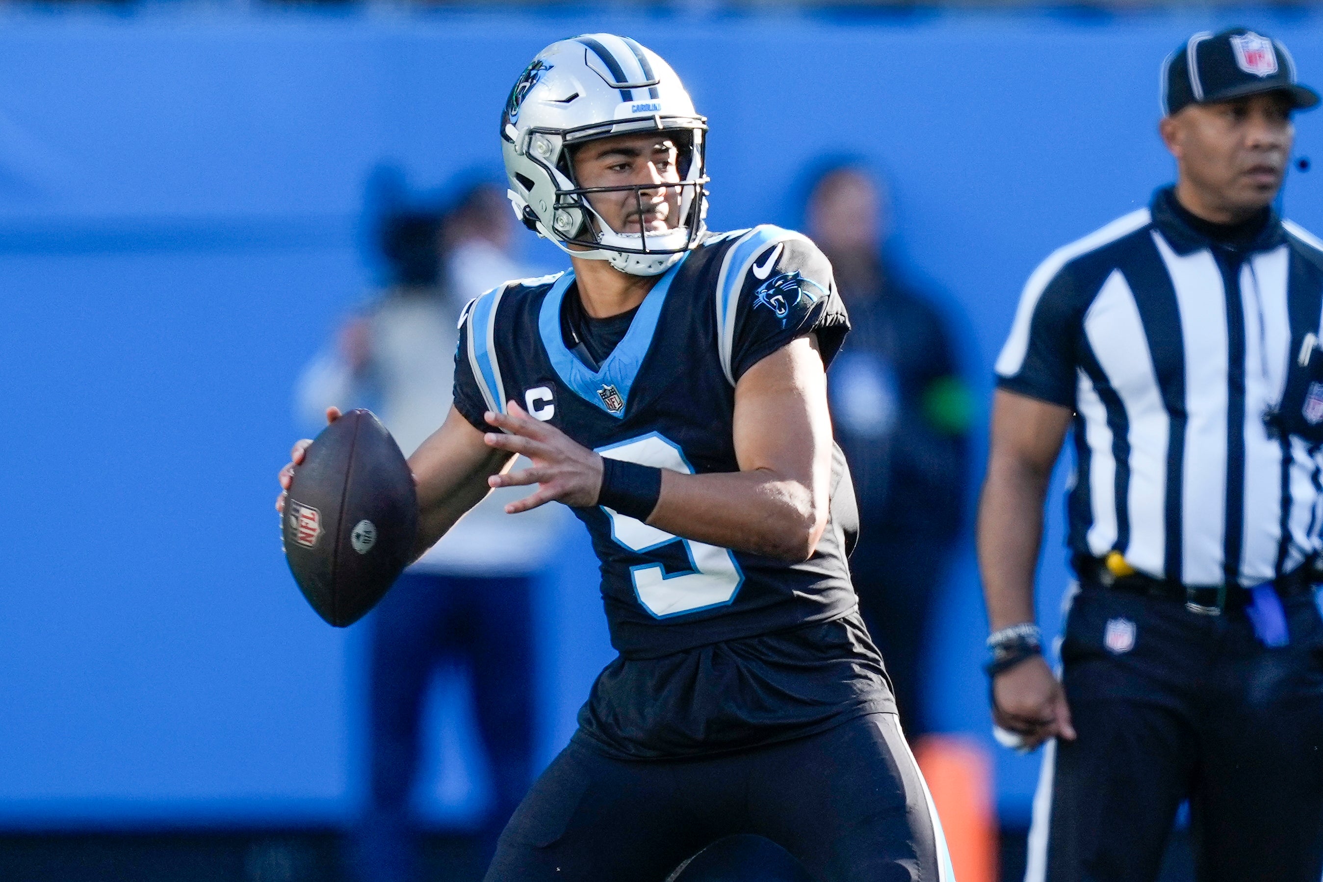 Nov 19, 2023; Charlotte, North Carolina, USA; Carolina Panthers quarterback Bryce Young (9) drops back to pass against the Dallas Cowboys during the second half at Bank of America Stadium. Mandatory Credit: Jim Dedmon-USA TODAY Sports
