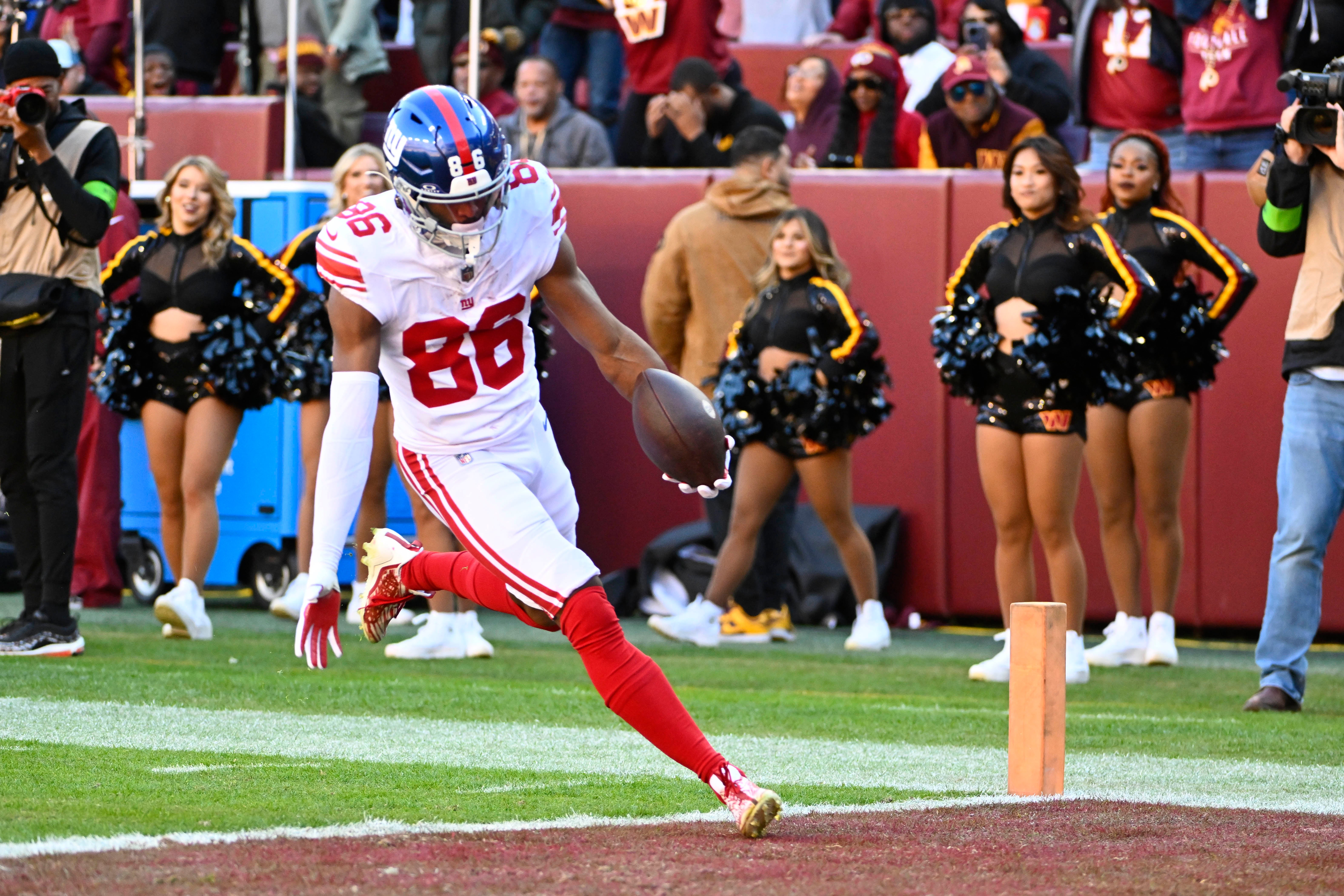 New York Giants wide receiver Darius Slayton scores a touchdown against the Washington Commanders during the first half at FedExField