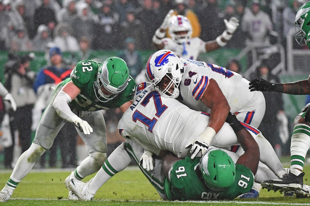 Buffalo Bills at Philadelphia Eagles Buffalo Bills quarterback Josh Allen gets a push into the end zone from guard O'Cyrus Torrence past Philadelphia Eagles defensive tackle Fletcher Cox and safety Reed Blankenship.