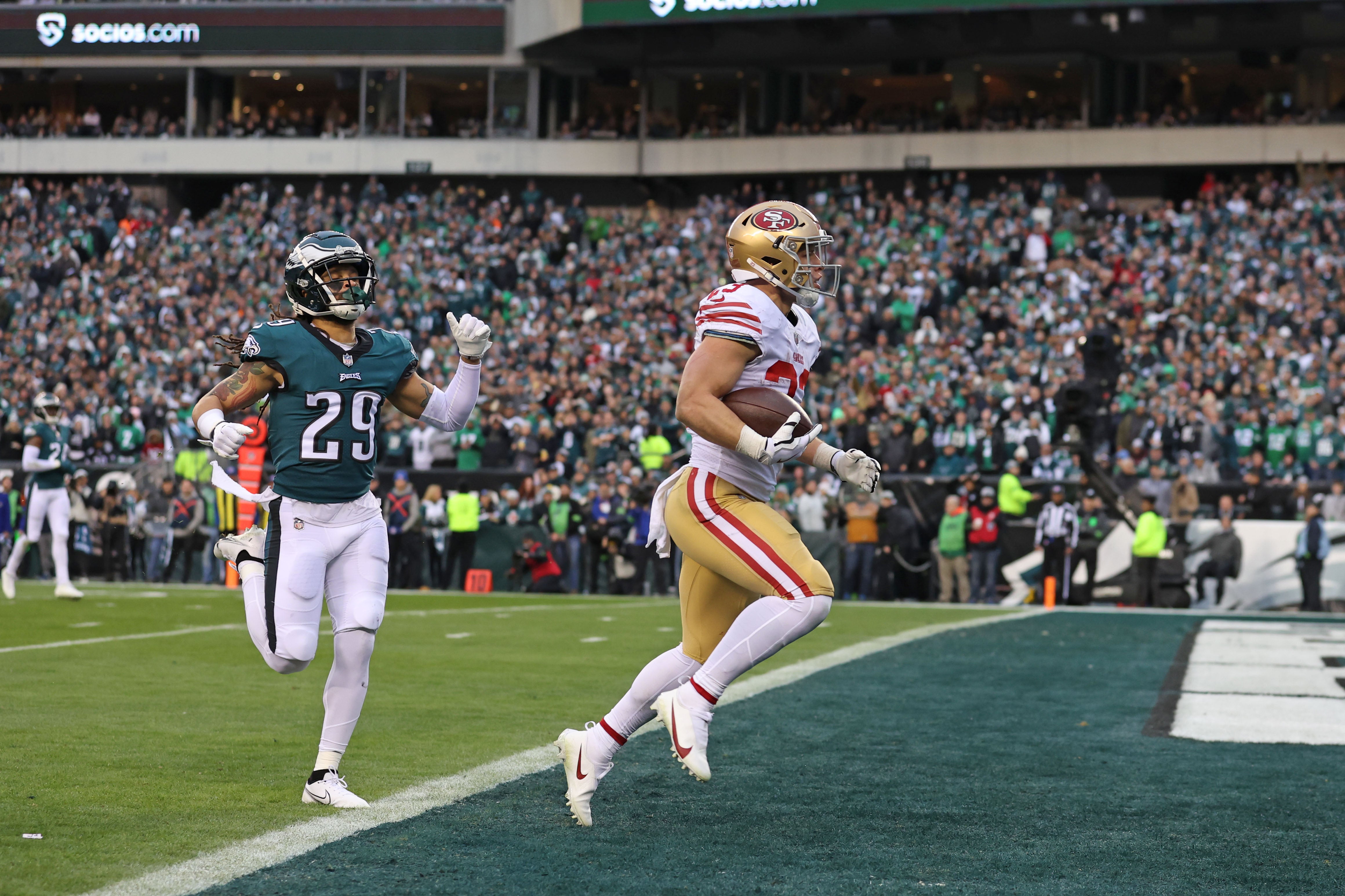 Jan 29, 2023; Philadelphia, Pennsylvania, USA; San Francisco 49ers running back Christian McCaffrey (23) scores a 23-yard touchdown run against the Philadelphia Eagles during the second quarter in the NFC Championship game at Lincoln Financial Field.