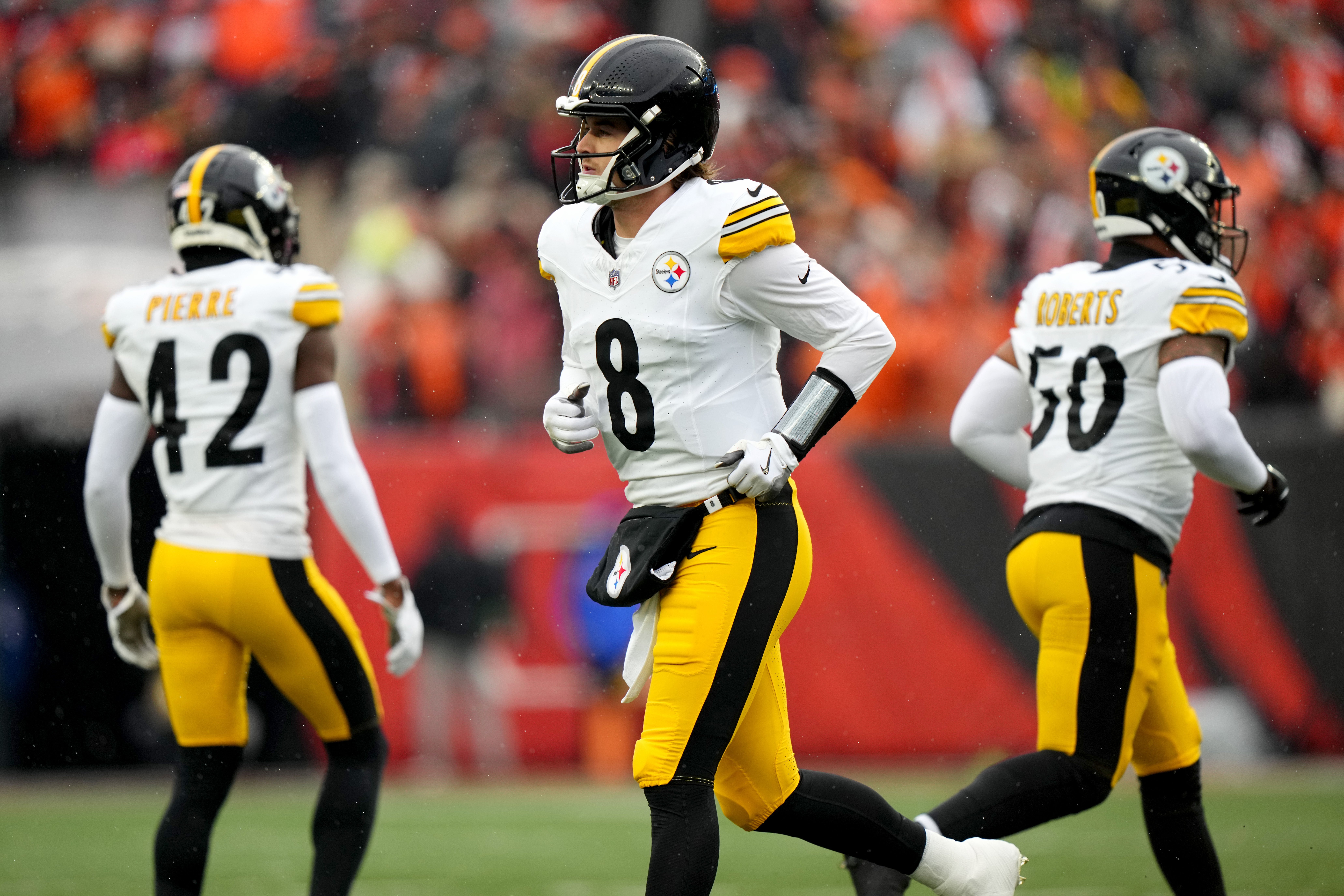 Nov 26, 2023; Cincinnati, Ohio, USA; Pittsburgh Steelers quarterback Kenny Pickett (8) jogs off the field after a stalled offensive drive in the first quarter against the Cincinnati Bengals at Paycor Stadium. Mandatory Credit: Kareem Elgazzar-USA TODAY Sports  