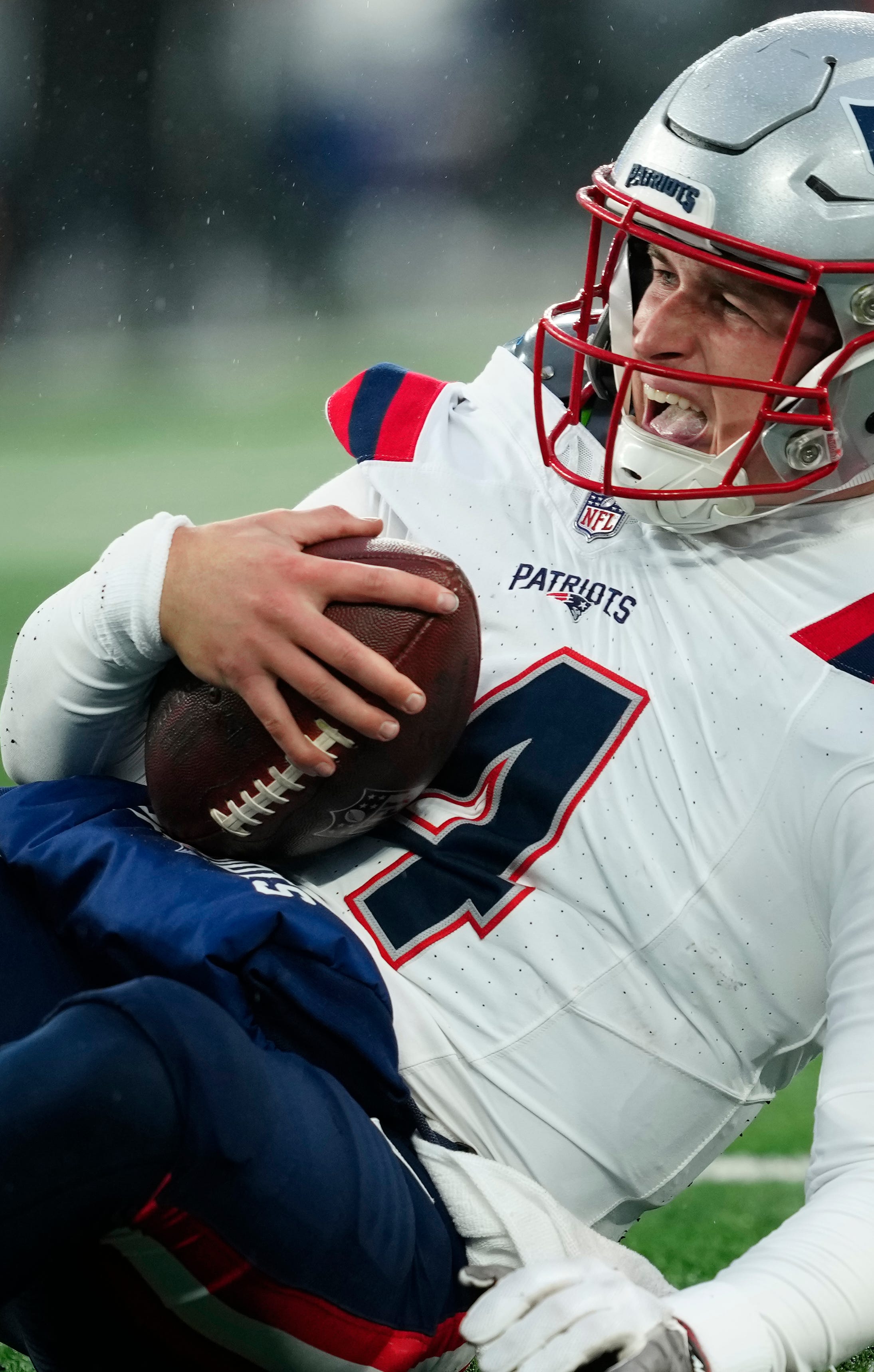 New England Patriots quarterback Bailey Zappe reacts after being sacked in the fourth quarter