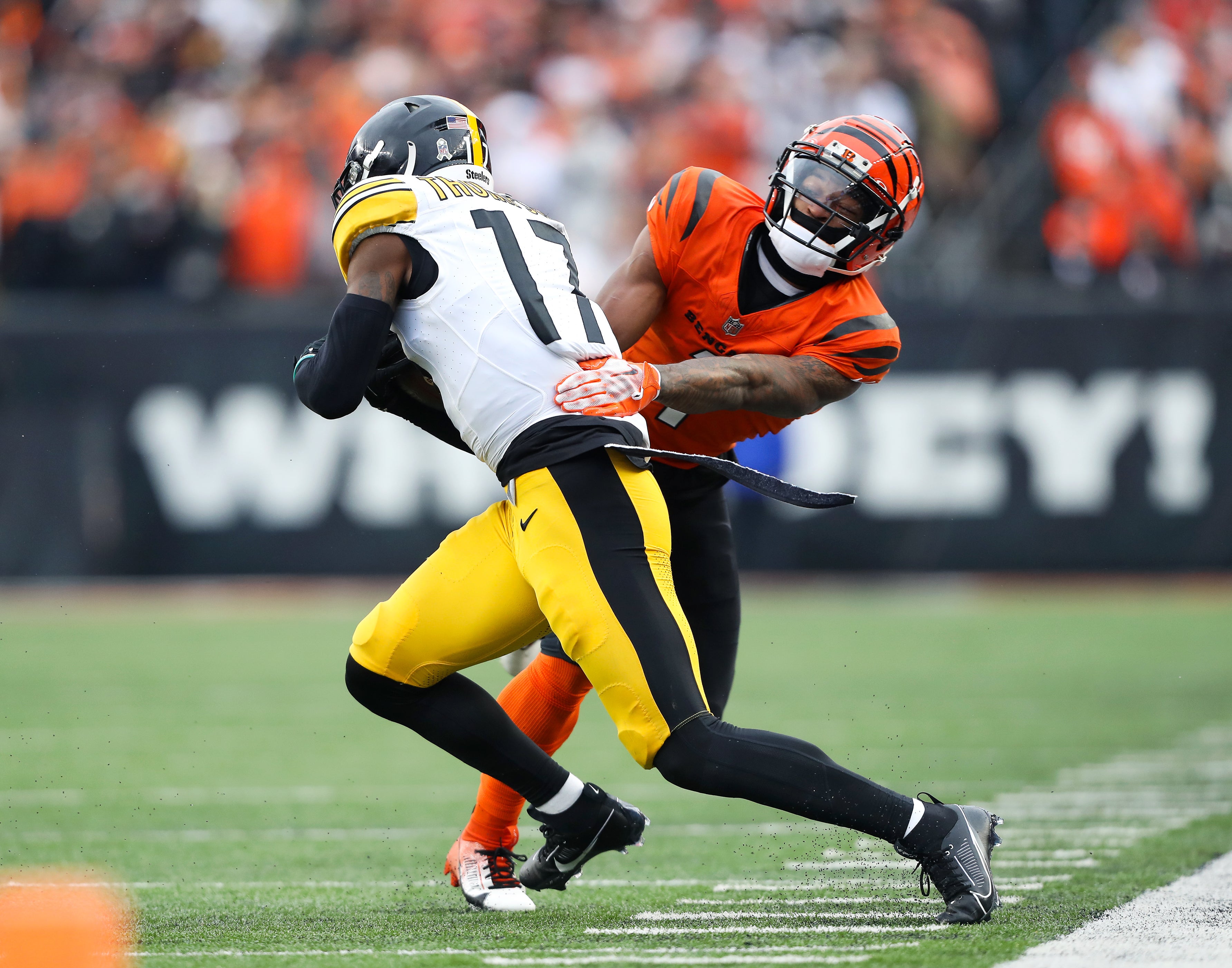 Pittsburgh Steelers safety Trenton Thompson (17) catches the interception as Cincinnati Bengals wide receiver Ja'Marr Chase (1) tackles during the third quarter at Paycor Stadium.