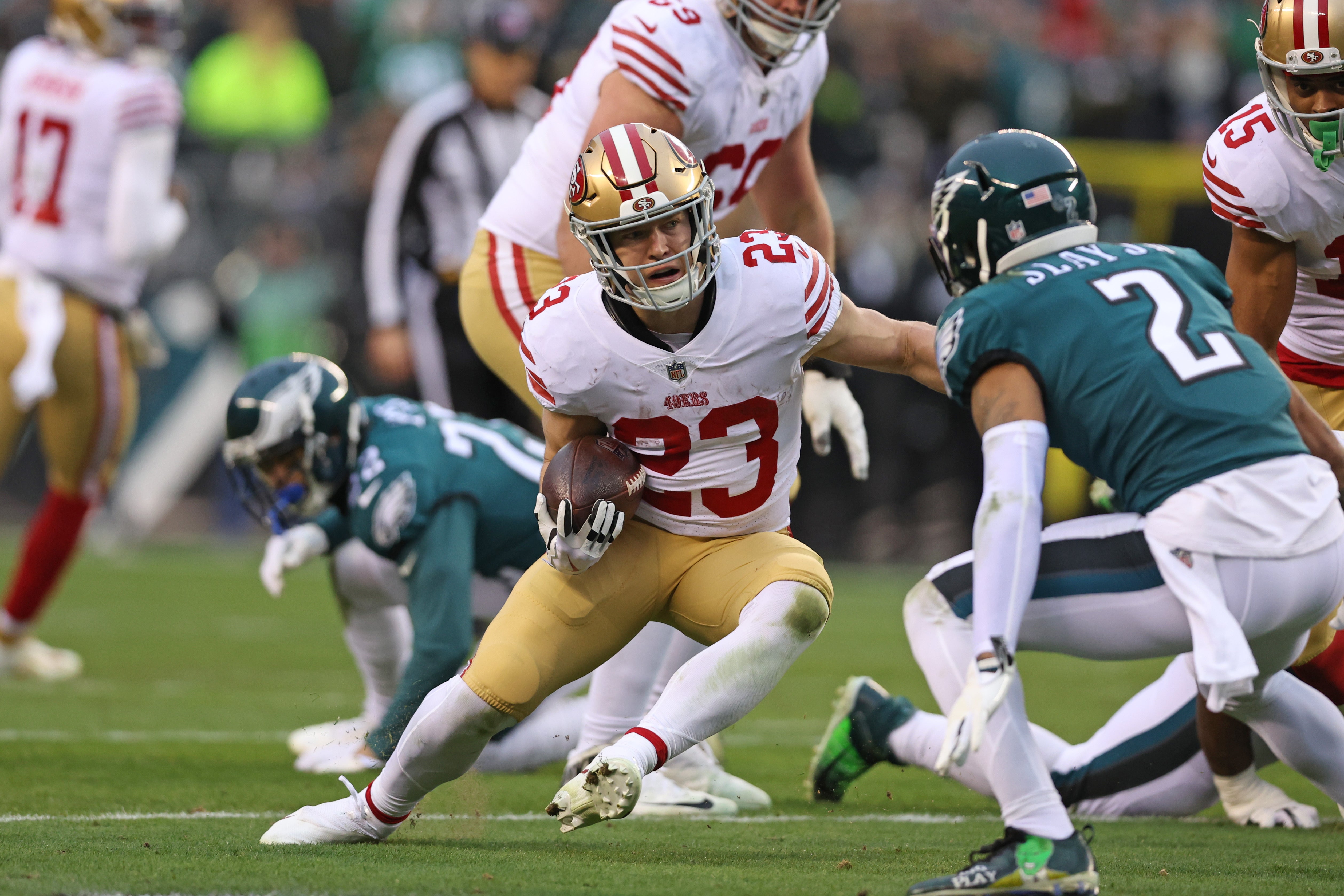 Jan 29, 2023; Philadelphia, Pennsylvania, USA; San Francisco 49ers running back Christian McCaffrey (23) makes a move on Philadelphia Eagles cornerback Darius Slay (2) on way to a 23-yard touchdown run during the second quarter in the NFC Championship game at Lincoln Financial Field.