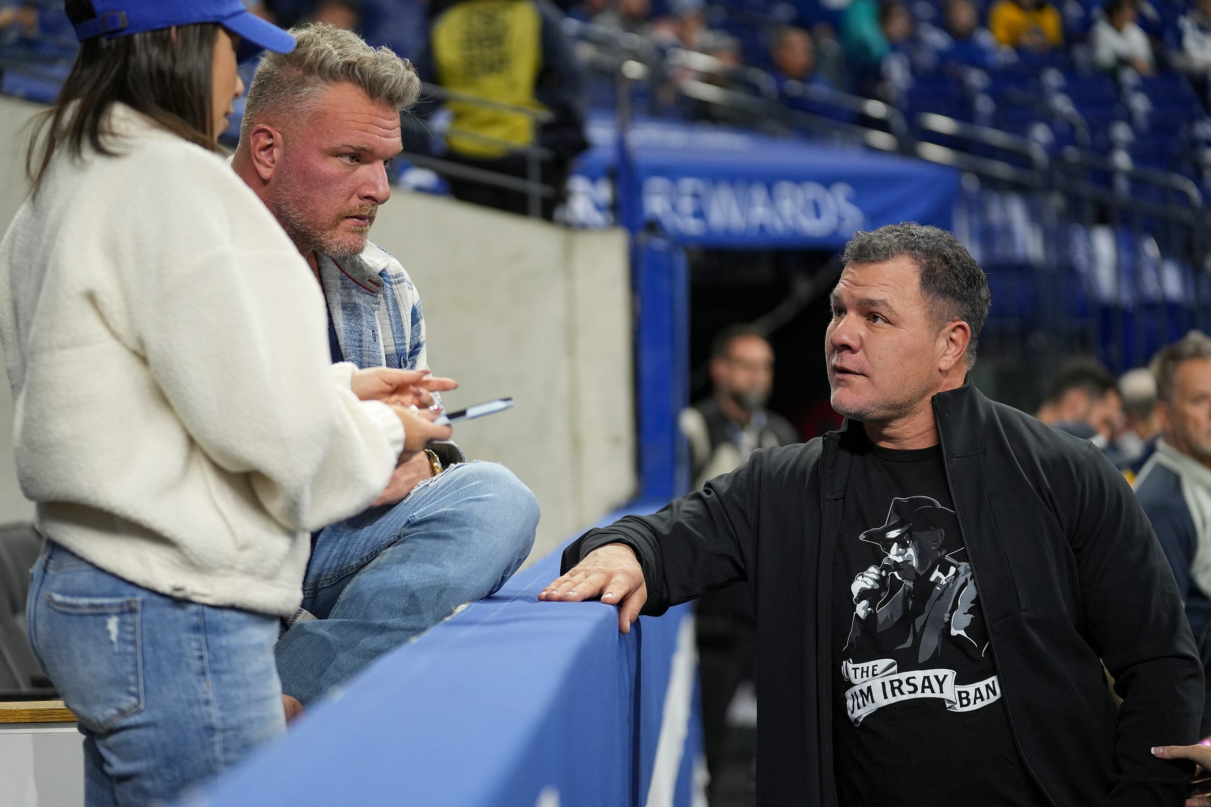 Former Indianapolis Colts Pat McAfee and Adam Vinatieri greet each other Sunday, Nov. 26, 2023, before the Colts face the Tampa Bay Buccaneers at Lucas Oil Stadium in Indianapolis.