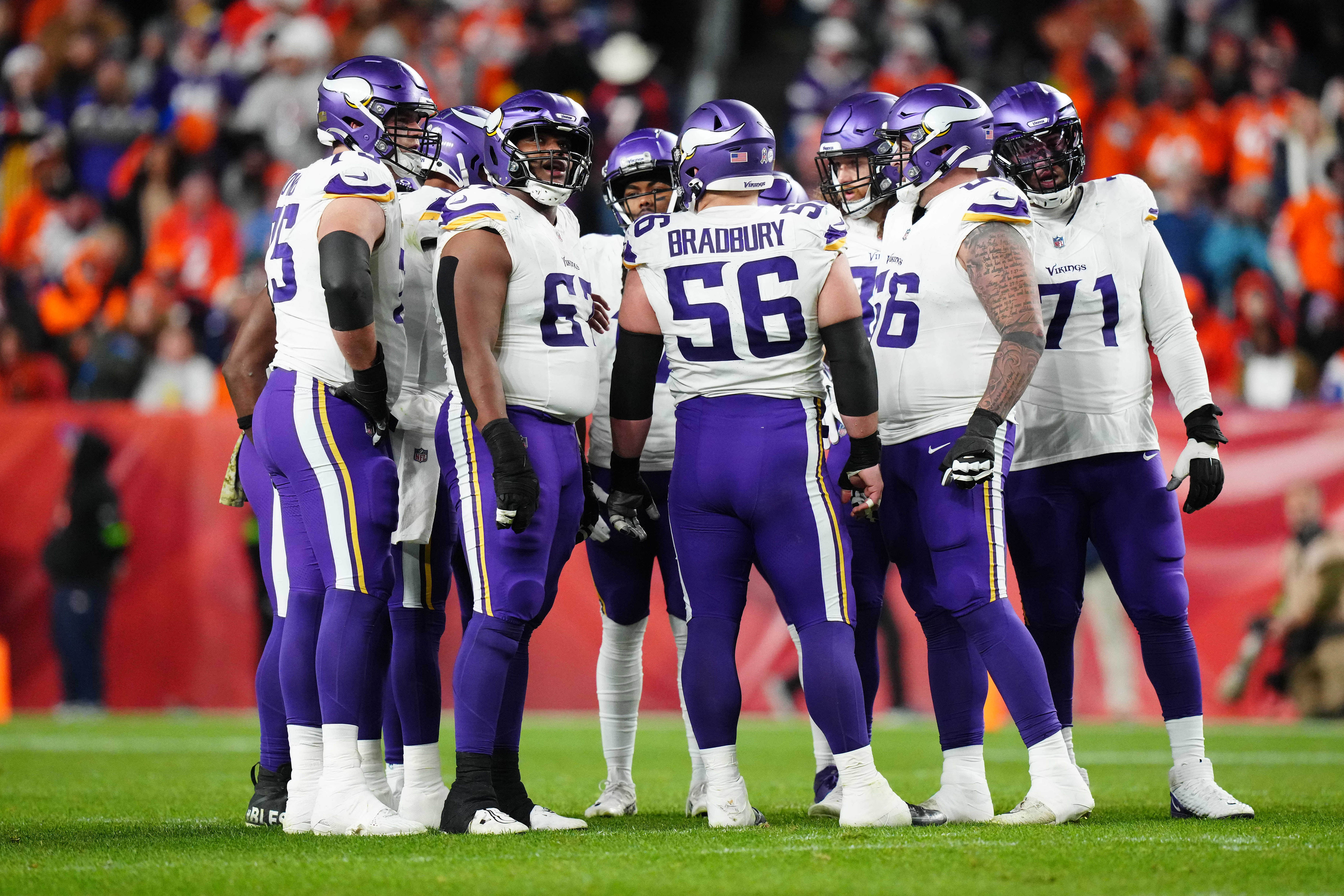 Nov 19, 2023; Denver, Colorado, USA; Member of the Minnesota Vikings huddle in the second quarter against the Denver Broncos at Empower Field at Mile High. Mandatory Credit: Ron Chenoy-USA TODAY Sports