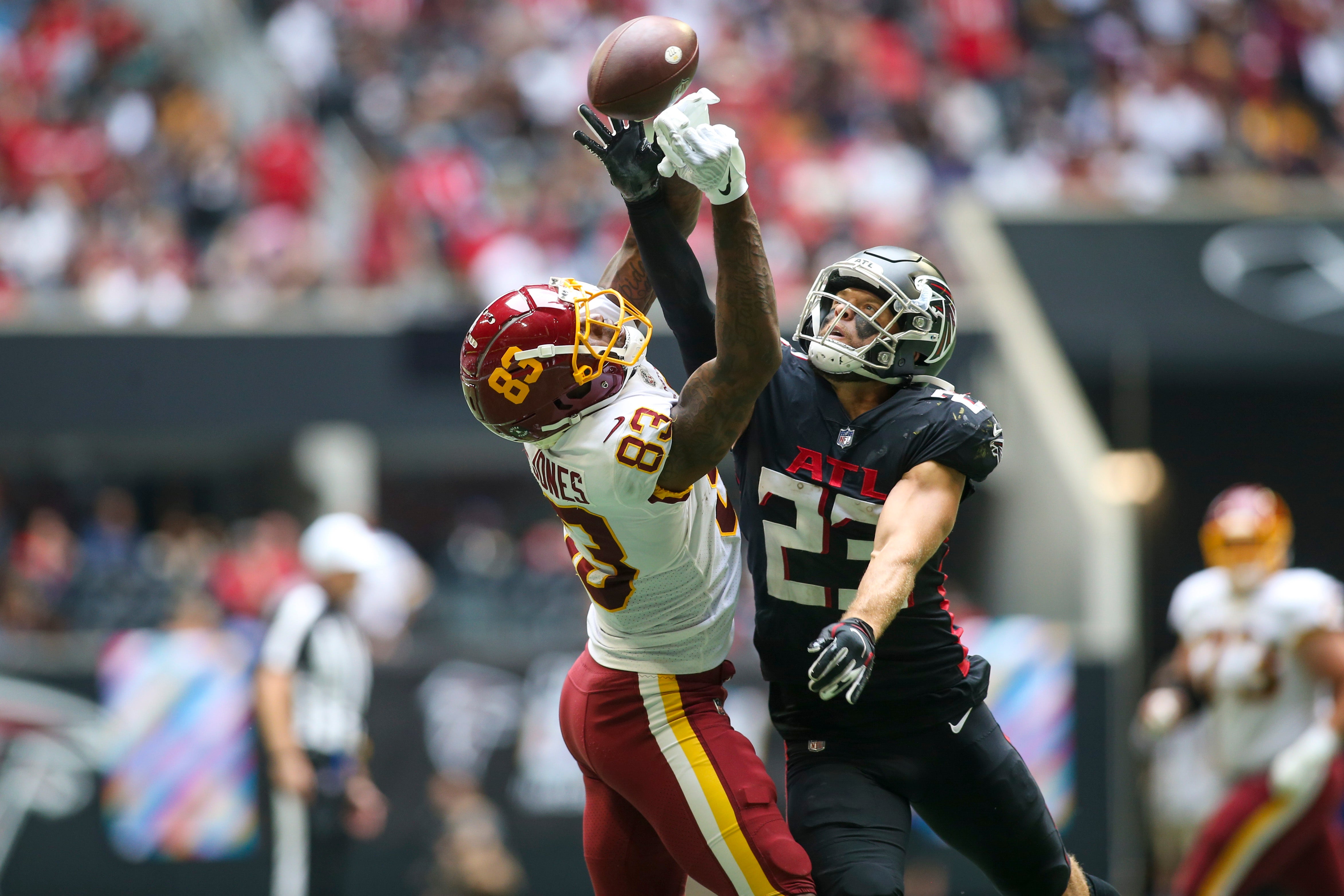 Oct 3, 2021; Atlanta, Georgia, USA; Atlanta Falcons free safety Erik Harris (23) breaks up a pass intended for Washington Football Team tight end Ricky Seals-Jones (83) in the second half at Mercedes-Benz Stadium.
