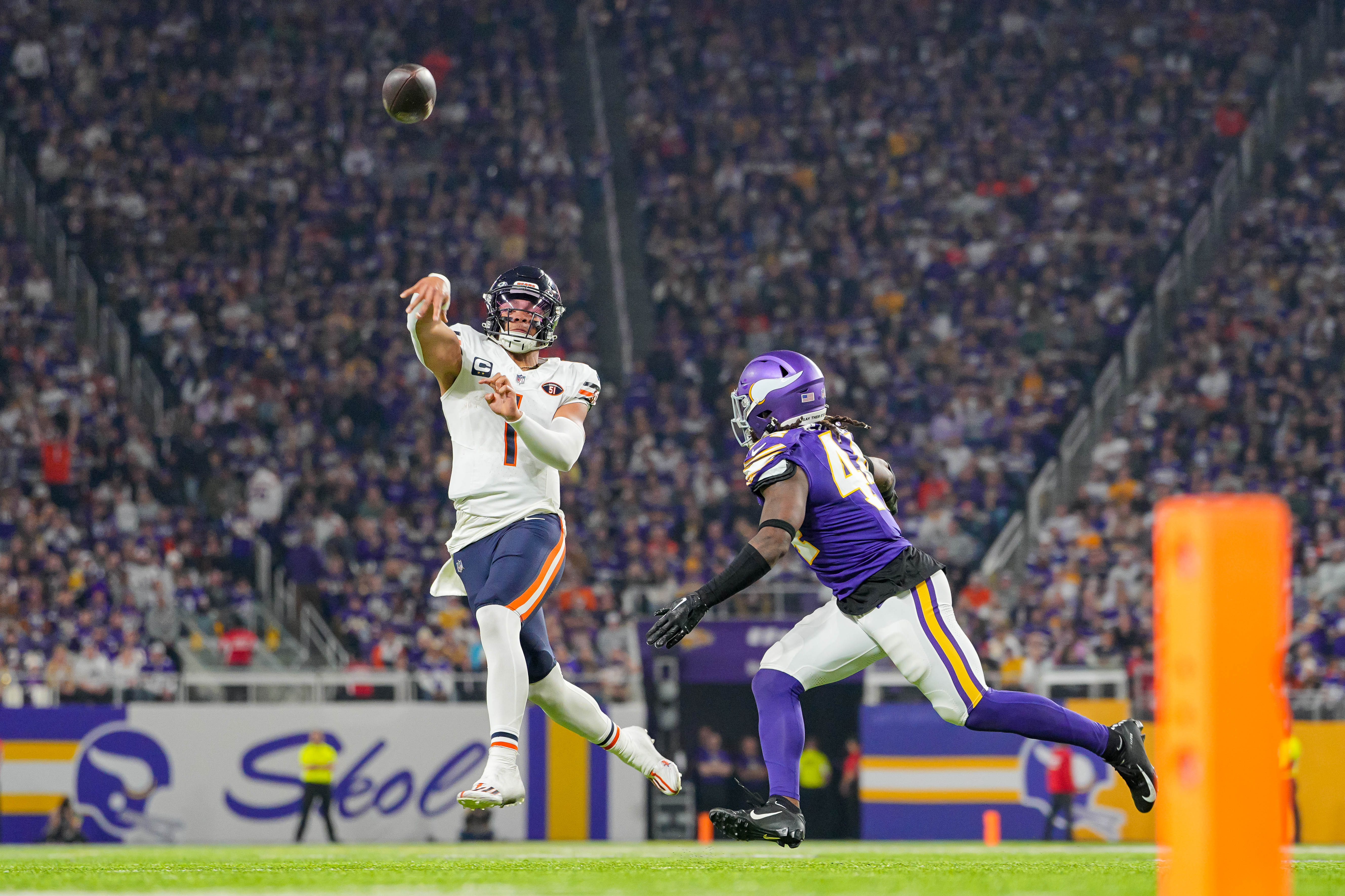 Nov 27, 2023; Minneapolis, Minnesota, USA; Chicago Bears quarterback Justin Fields (1) passes against the Minnesota Vikings in the second quarter at U.S. Bank Stadium.