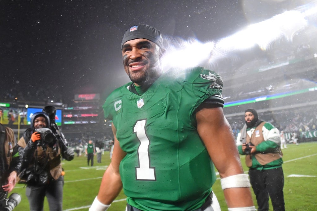 Philadelphia Eagles quarterback Jalen Hurts walks off the field after overtime win against the Buffalo Bills at Lincoln Financial Field.