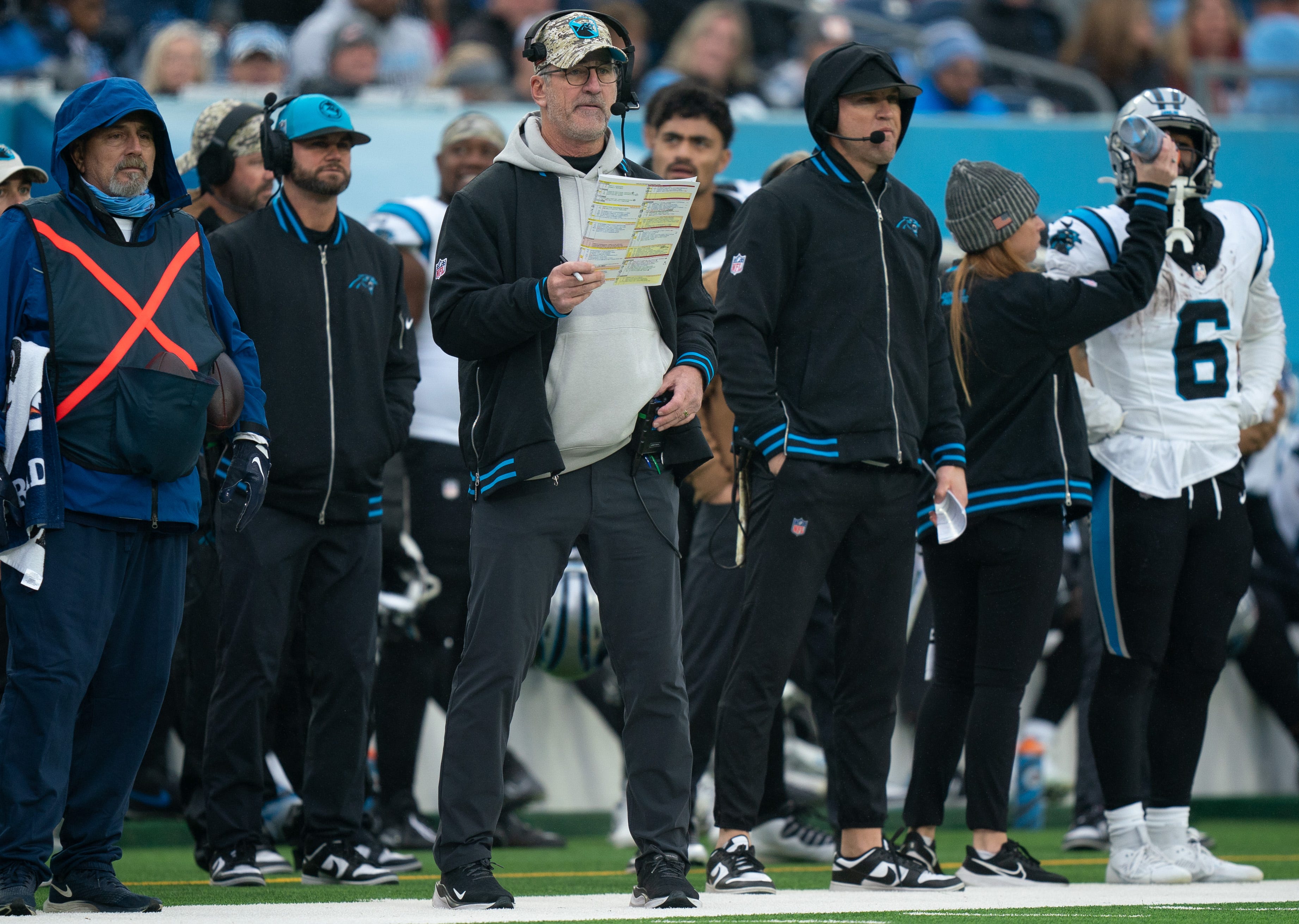 Carolina Panthers head coach Frank Reich, center, awaits a play against the Tennessee Titans during their game at Nissan Stadium in Nashville, Tenn., Sunday, Nov. 26, 2023.