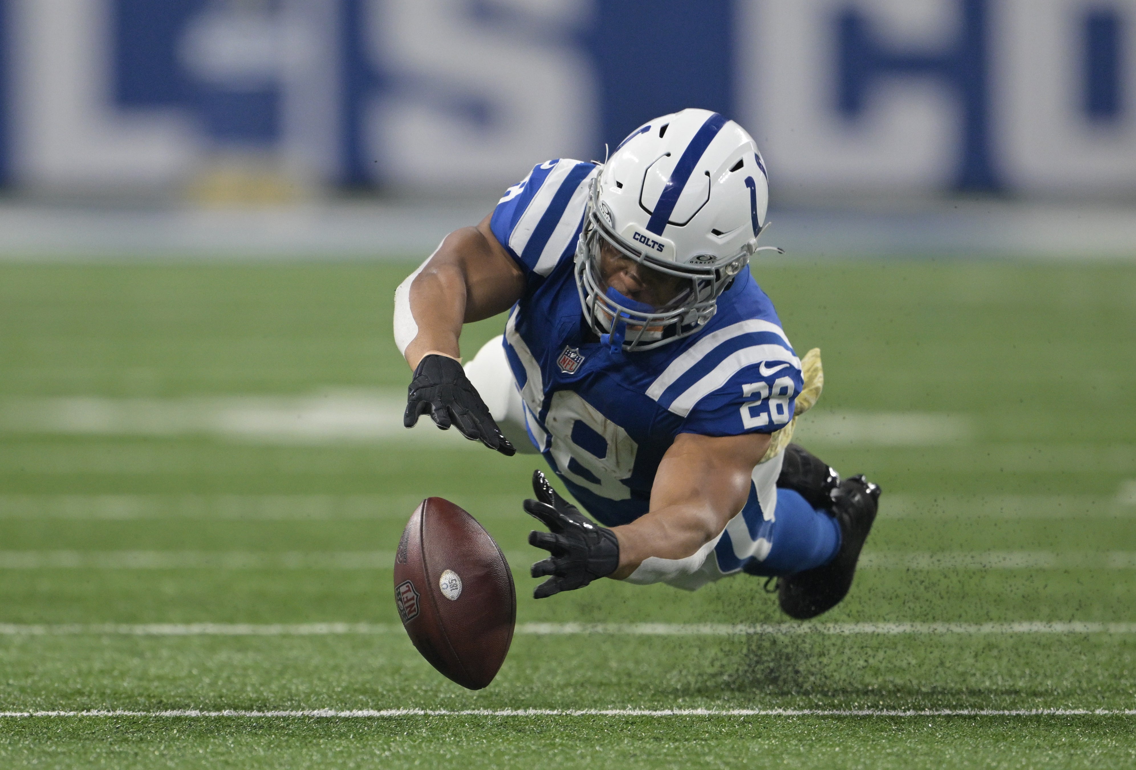 Nov 26, 2023; Indianapolis, Indiana, USA; Indianapolis Colts running back Jonathan Taylor (28) dives for a ball that is ruled incomplete during the second quarter against the Tampa Bay Buccaneers at Lucas Oil Stadium.