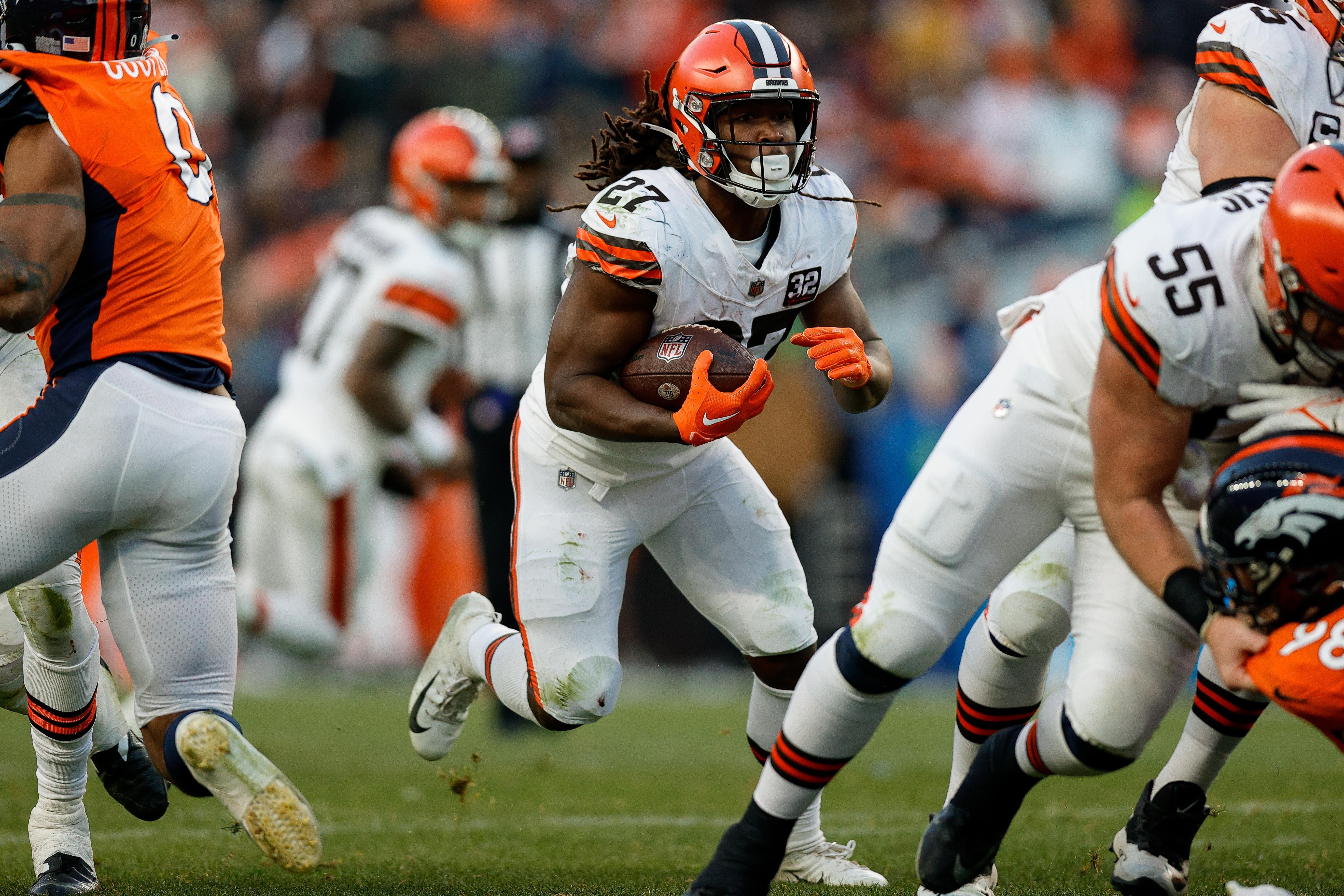 Nov 26, 2023; Denver, Colorado, USA; Cleveland Browns running back Kareem Hunt (27) runs the ball in the third quarter against the Denver Broncos at Empower Field at Mile High. Mandatory Credit: Isaiah J. Downing-USA TODAY Sports