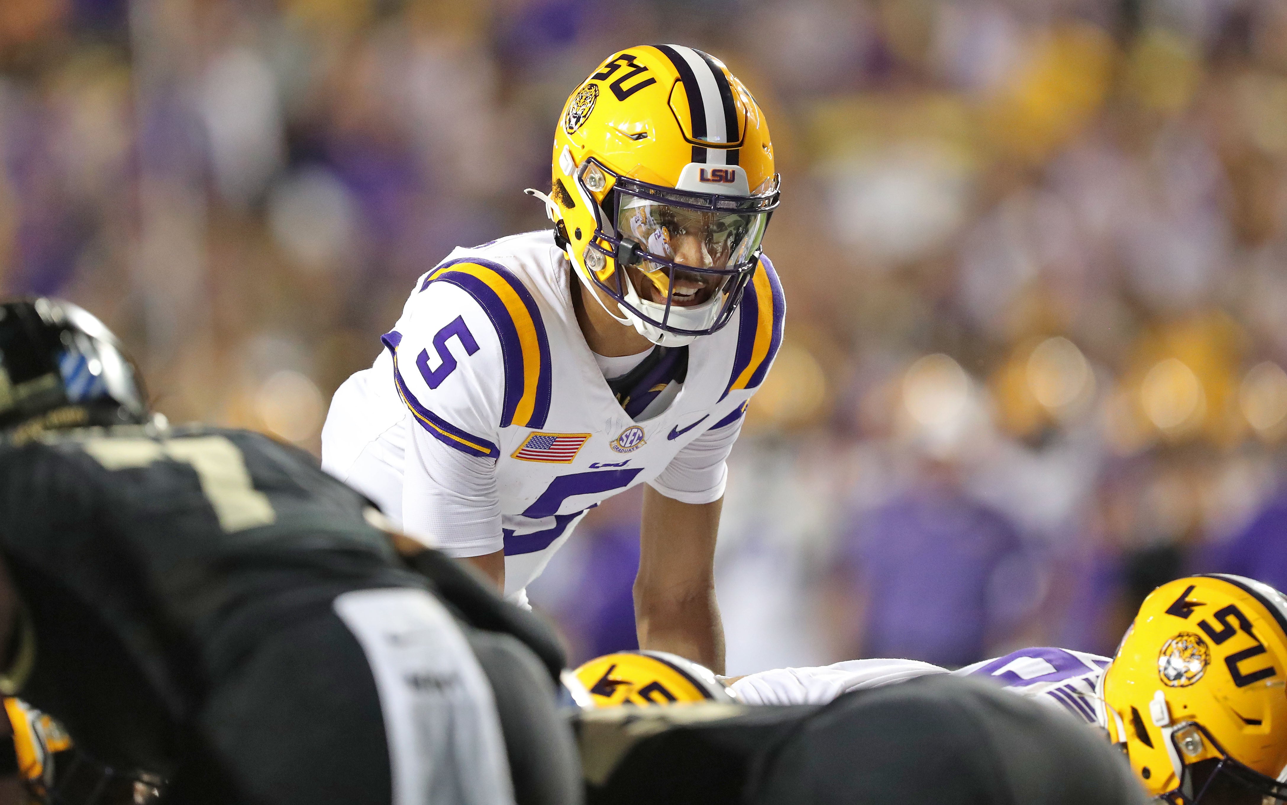 Oct 21, 2023; Baton Rouge, Louisiana, USA; LSU Tigers quarterback Jayden Daniels (5) calls a play at the line against the Army Black Knights during the first half at Tiger Stadium.
