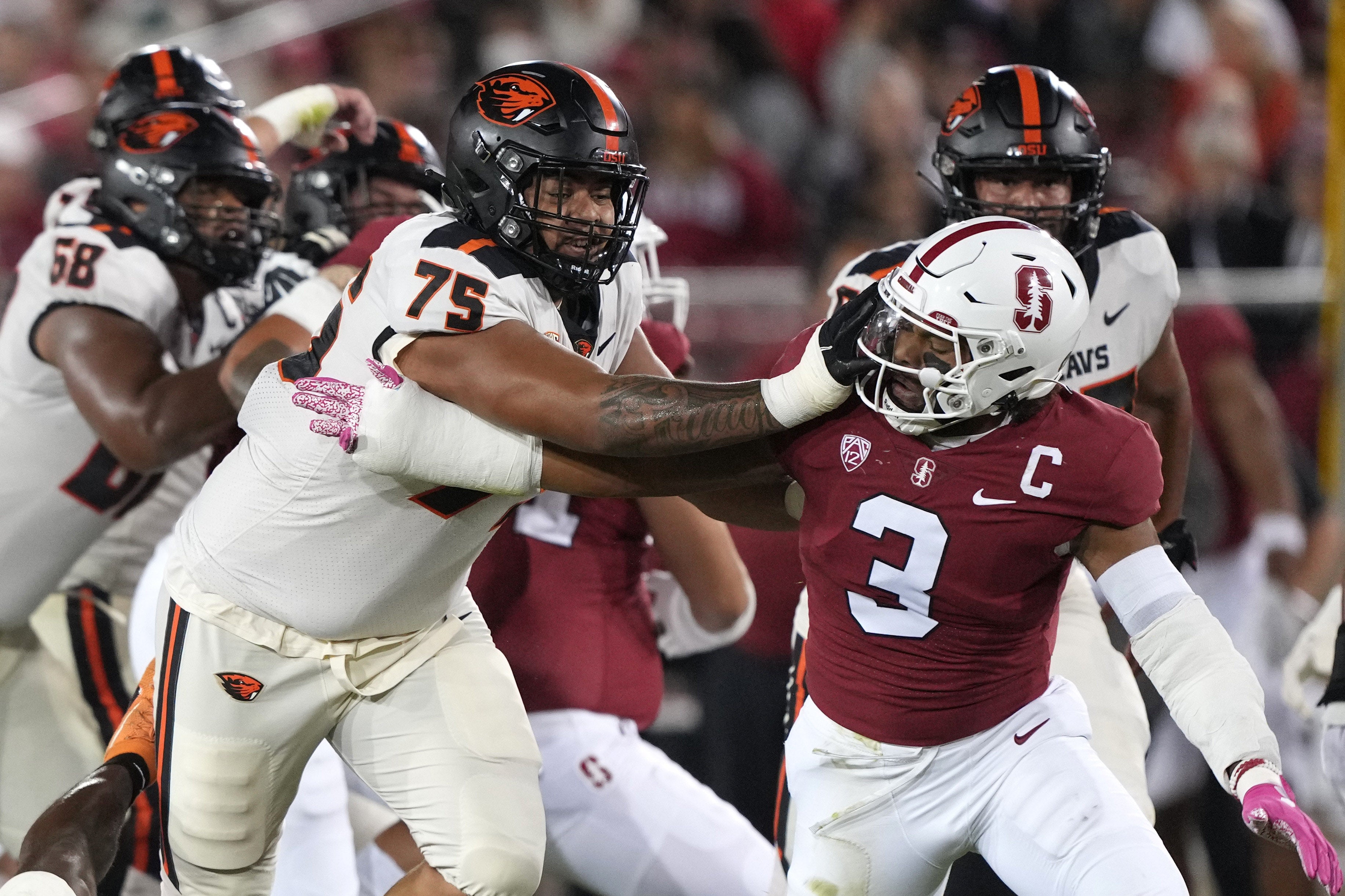 Oct 8, 2022; Stanford, California, USA; Oregon State Beavers offensive lineman Taliese Fuaga (75) blocks Stanford Cardinal linebacker Levani Damuni (3) during the first quarter at Stanford Stadium.