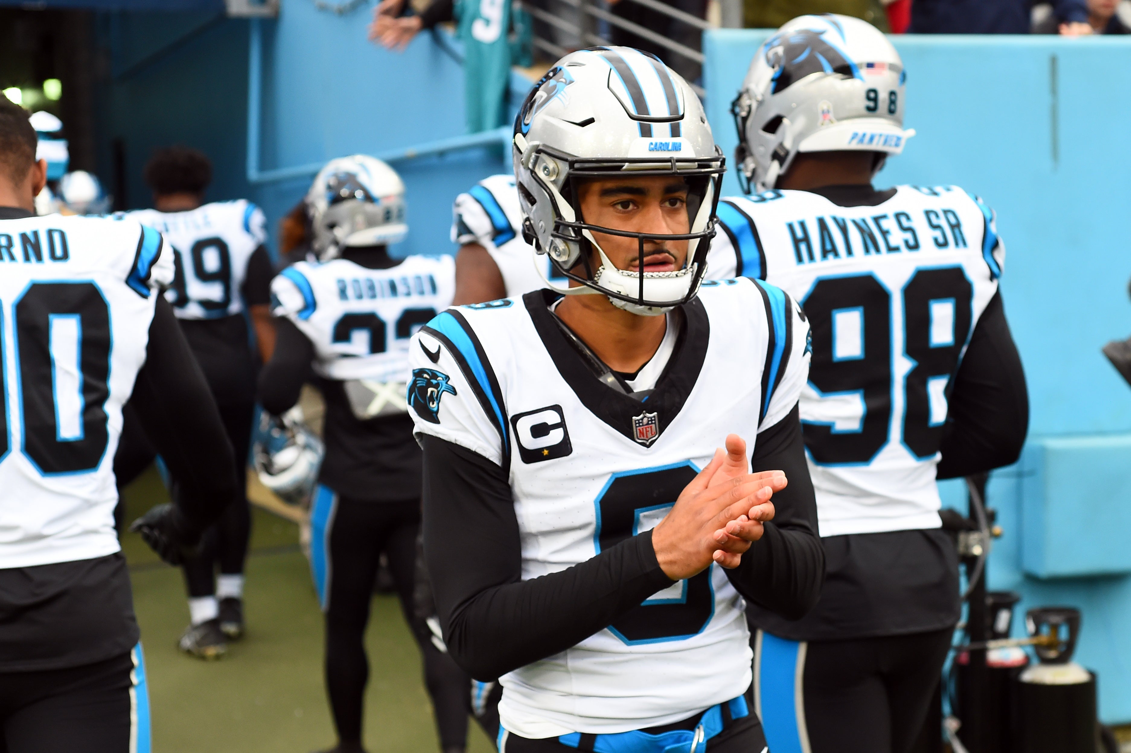 Nov 26, 2023; Nashville, Tennessee, USA; Carolina Panthers quarterback Bryce Young (9) slaps hands with players as they leave the field after warmups before the game against the Tennessee Titans at Nissan Stadium. Mandatory Credit: Christopher Hanewinckel-USA TODAY Sports