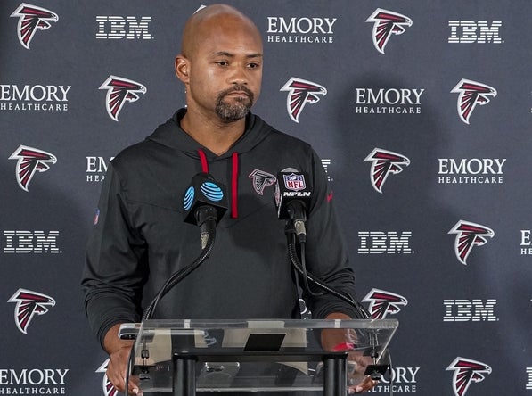 Atlanta Falcons general manager Terry Fontenot shown being interviewed by the media during training camp at IBM Performance Field.