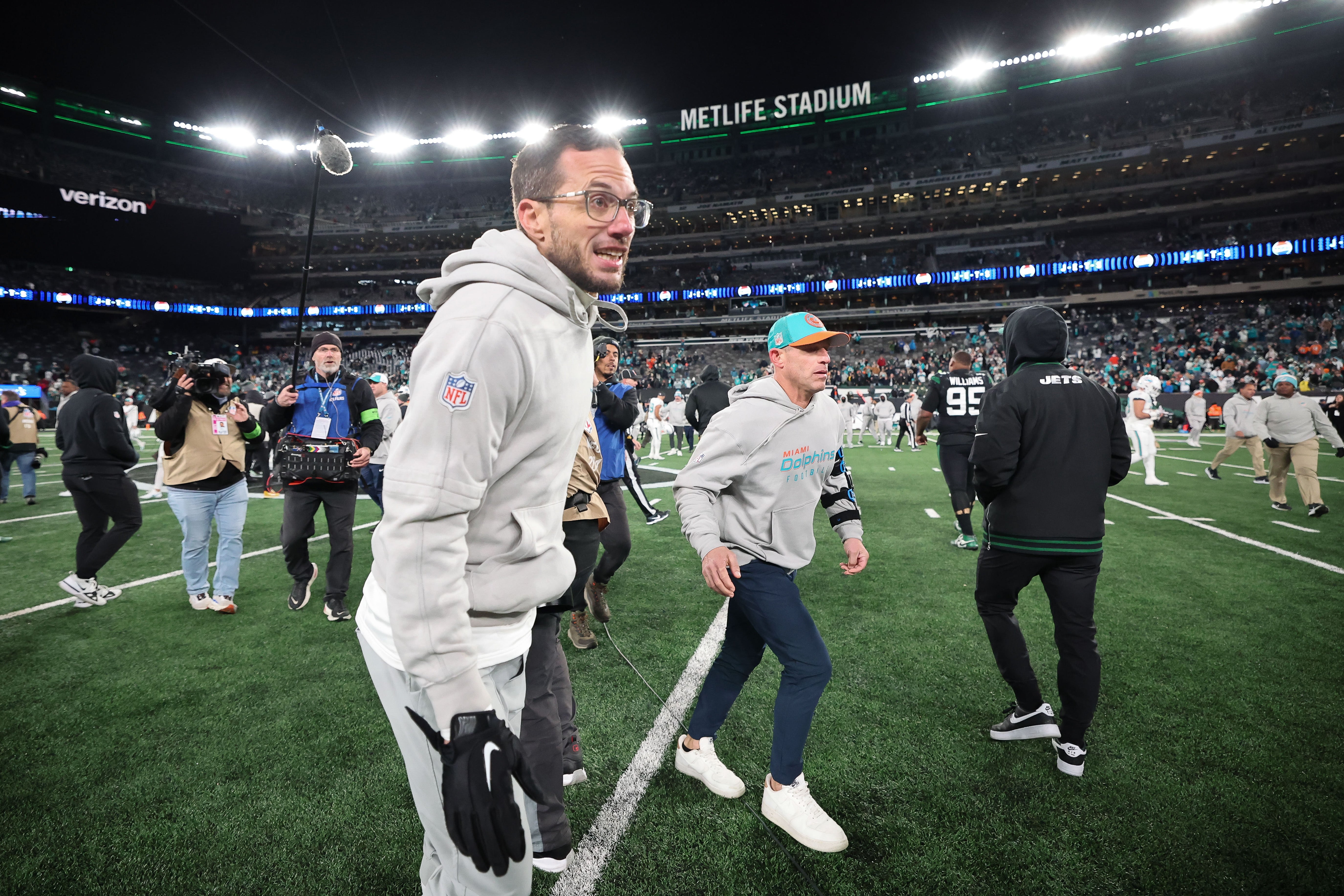 Nov 24, 2023; East Rutherford, New Jersey, USA; Miami Dolphins head coach Mike McDaniel runs off the field after the game against the New York Jets at MetLife Stadium. Mandatory Credit: Vincent Carchietta-USA TODAY Sports