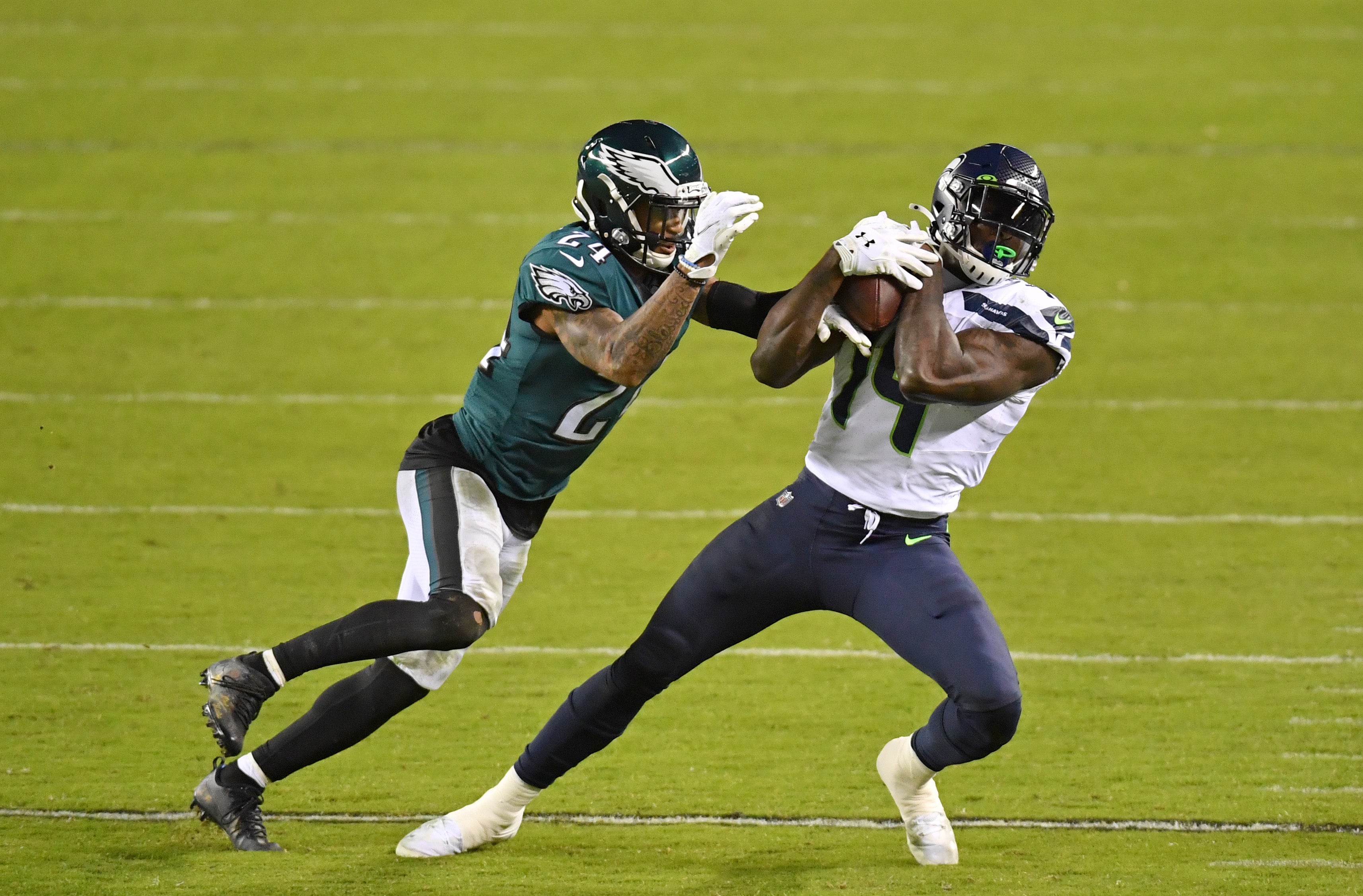 Nov 30, 2020; Philadelphia, Pennsylvania, USA; Seattle Seahawks wide receiver DK Metcalf (14) makes a catch against Philadelphia Eagles cornerback Darius Slay (24) during the third quarter at Lincoln Financial Field.