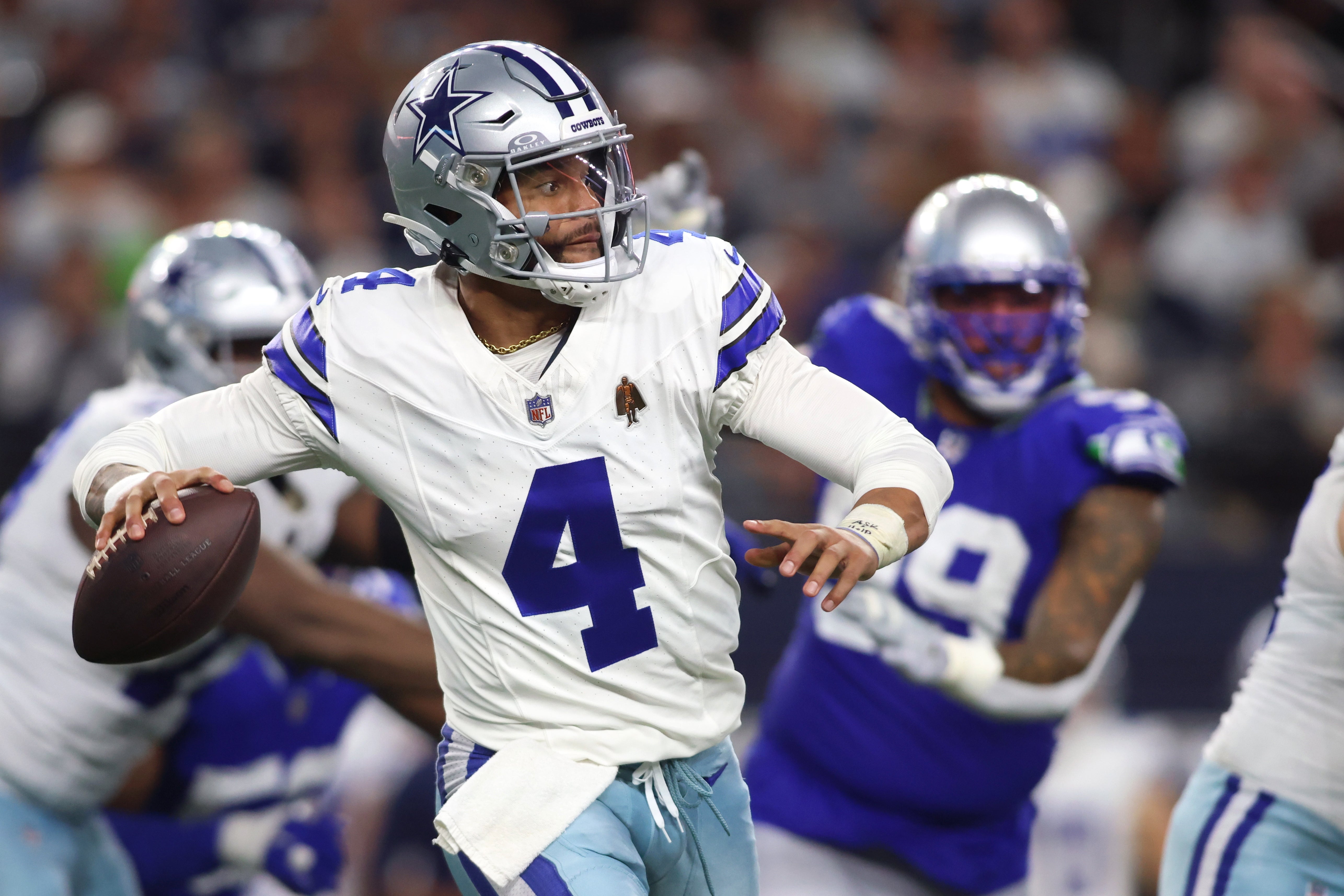 Dallas Cowboys quarterback Dak Prescott (4) throws a pass against the Seattle Seahawks during the second half at AT&T Stadium.