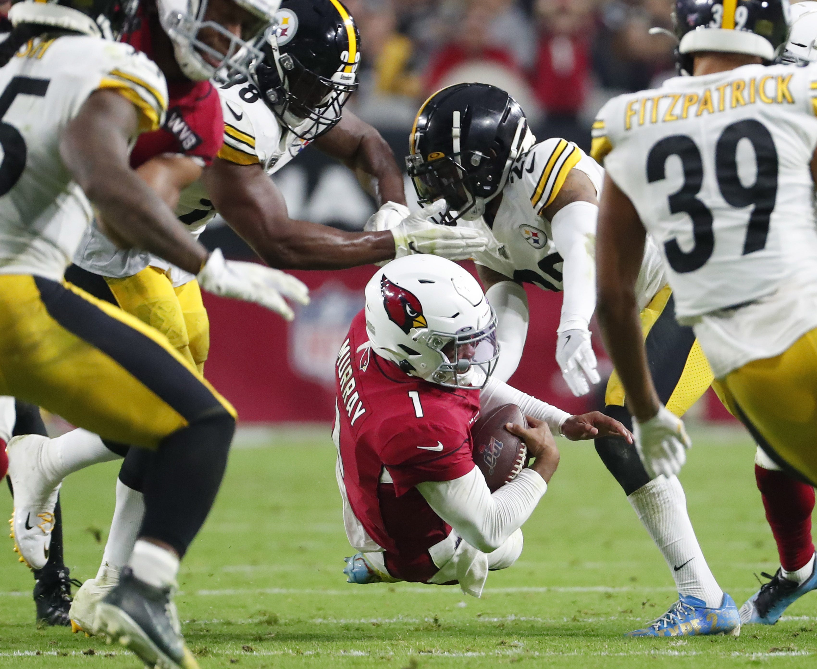 Arizona Cardinals quarterback Kyler Murray (1) scrambles between Pittsburgh Steelers inside linebacker Vince Williams (98) and cornerback Steven Nelson (22) during the third quarter at State Farm Stadium December 8, 2019. Steelers Vs Cardinals