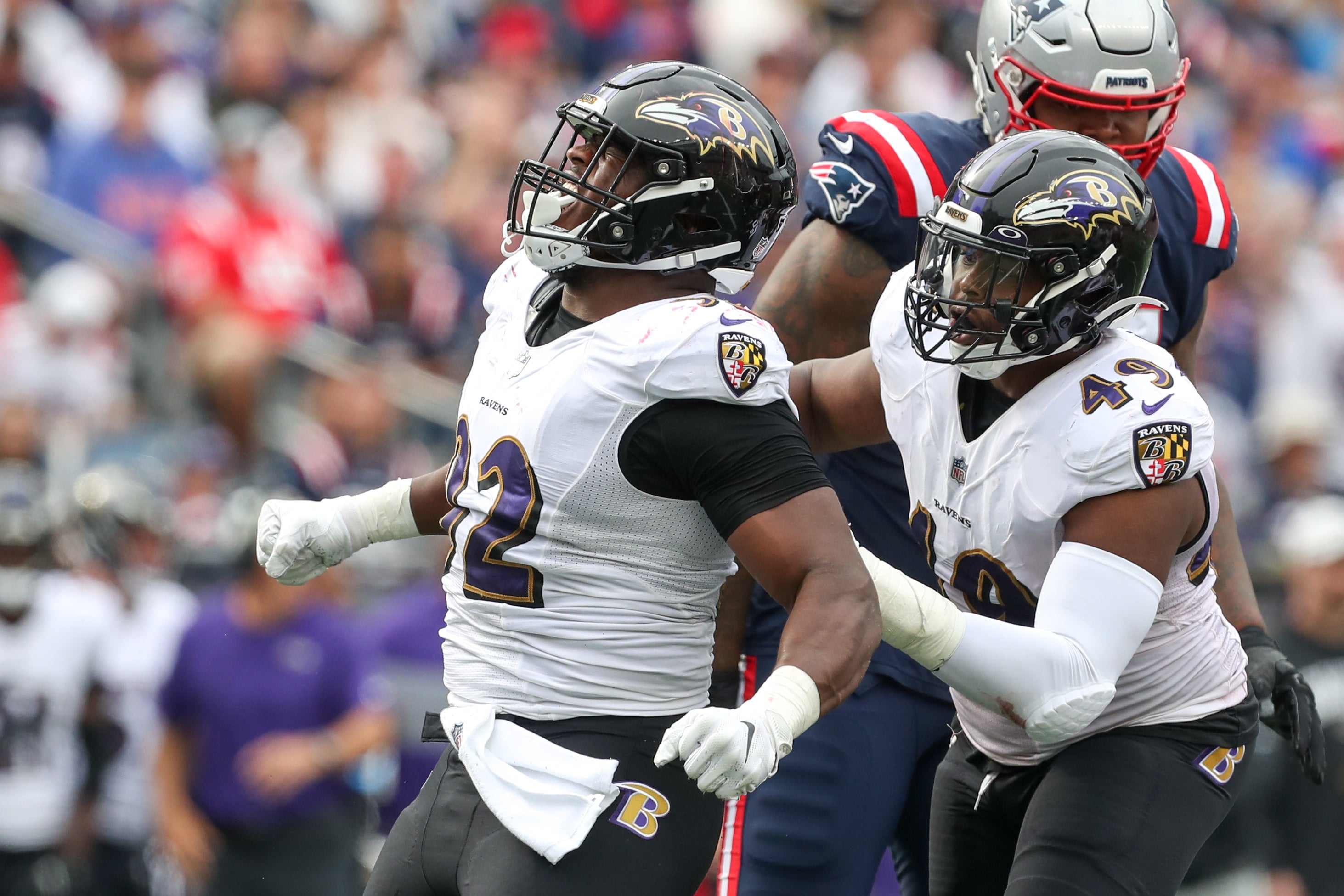 Sep 25, 2022; Foxborough, Massachusetts, USA; Baltimore Ravens defensive end Justin Madubuike (92) celebrates after tackle during the second half against the New England Patriots at Gillette Stadium. Mandatory Credit: Paul Rutherford-USA TODAY Sports  
