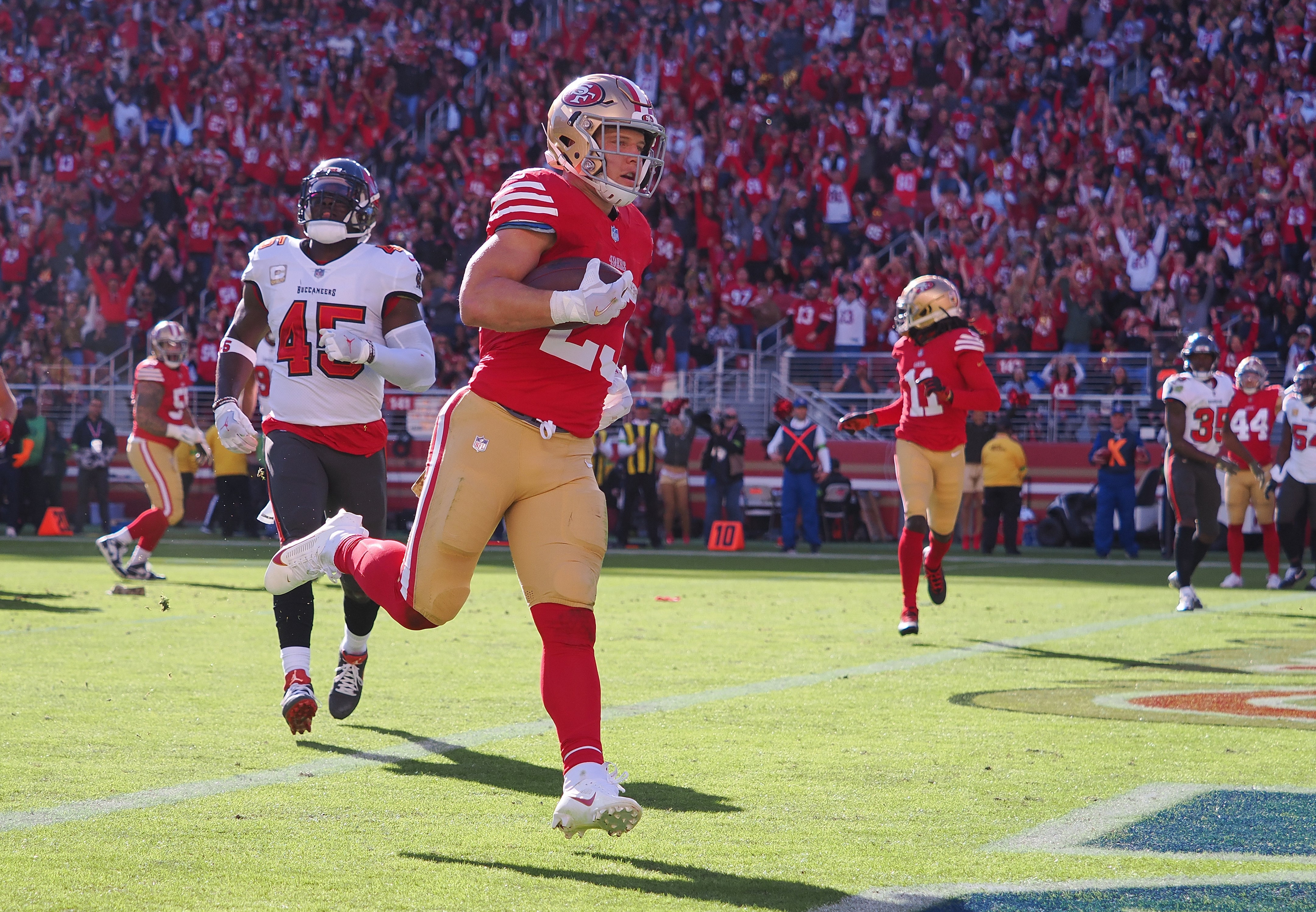 Nov 19, 2023; Santa Clara, California, USA; San Francisco 49ers running back Christian McCaffrey (23) scores a touchdown against the Tampa Bay Buccaneers during the first quarter at Levi's Stadium.