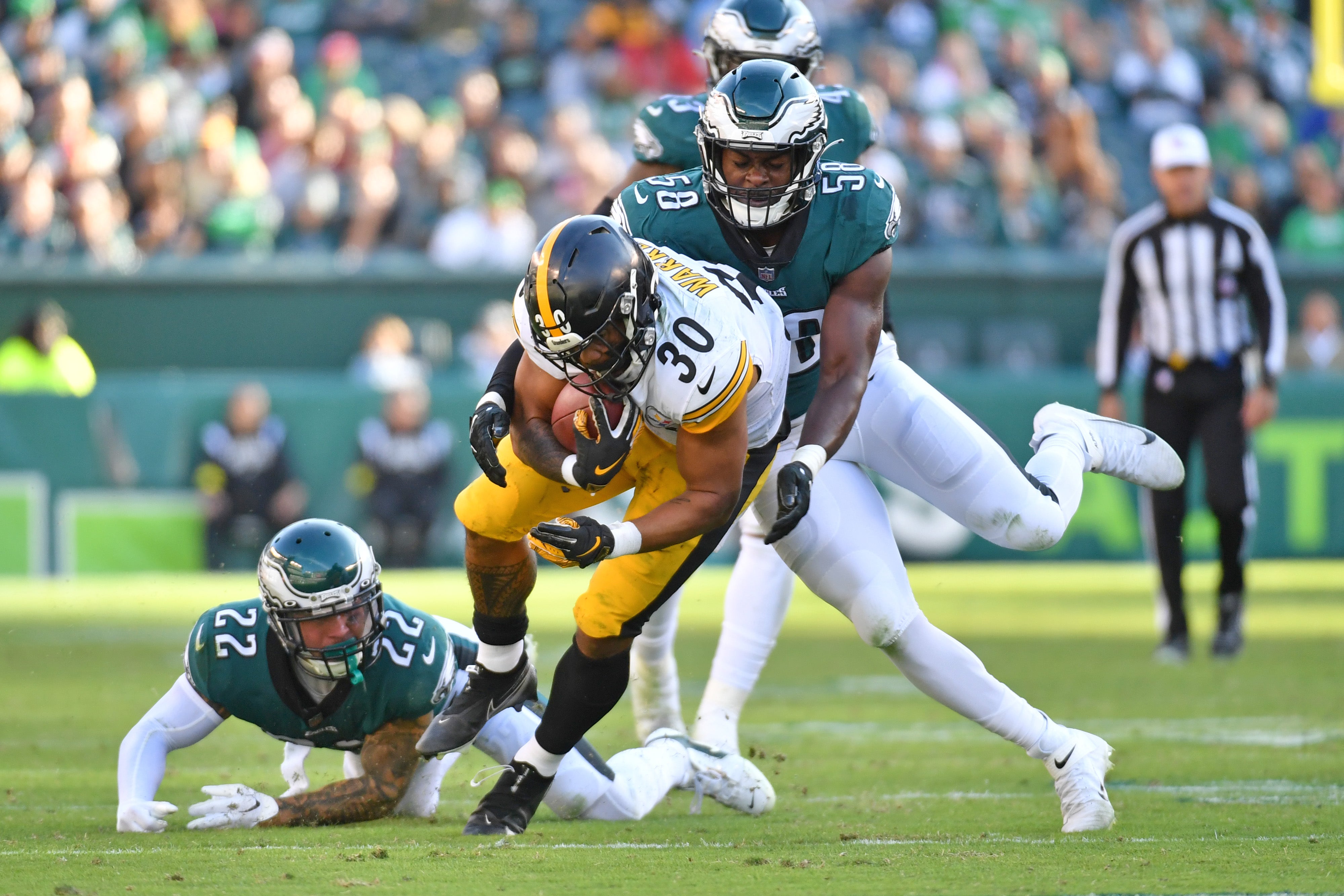 Oct 30, 2022; Philadelphia, Pennsylvania, USA; Pittsburgh Steelers running back Jaylen Warren (30) is tackled by Philadelphia Eagles safety Marcus Epps (22) and linebacker Kyron Johnson (58) during the fourth quarter at Lincoln Financial Field. Mandatory Credit: Eric Hartline-USA TODAY Sports